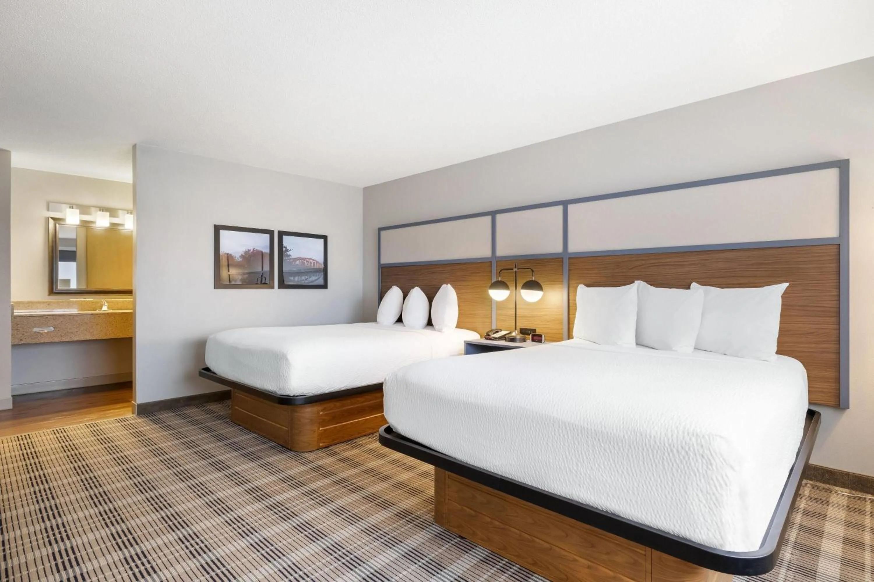 Bed in AmericInn by Wyndham Valley City Conference Center