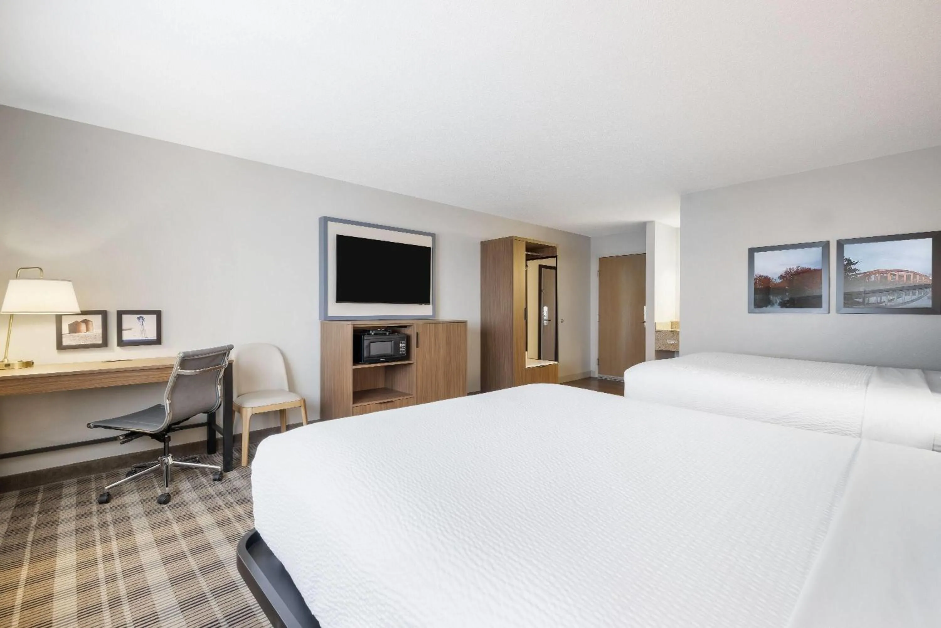 Bed in AmericInn by Wyndham Valley City Conference Center