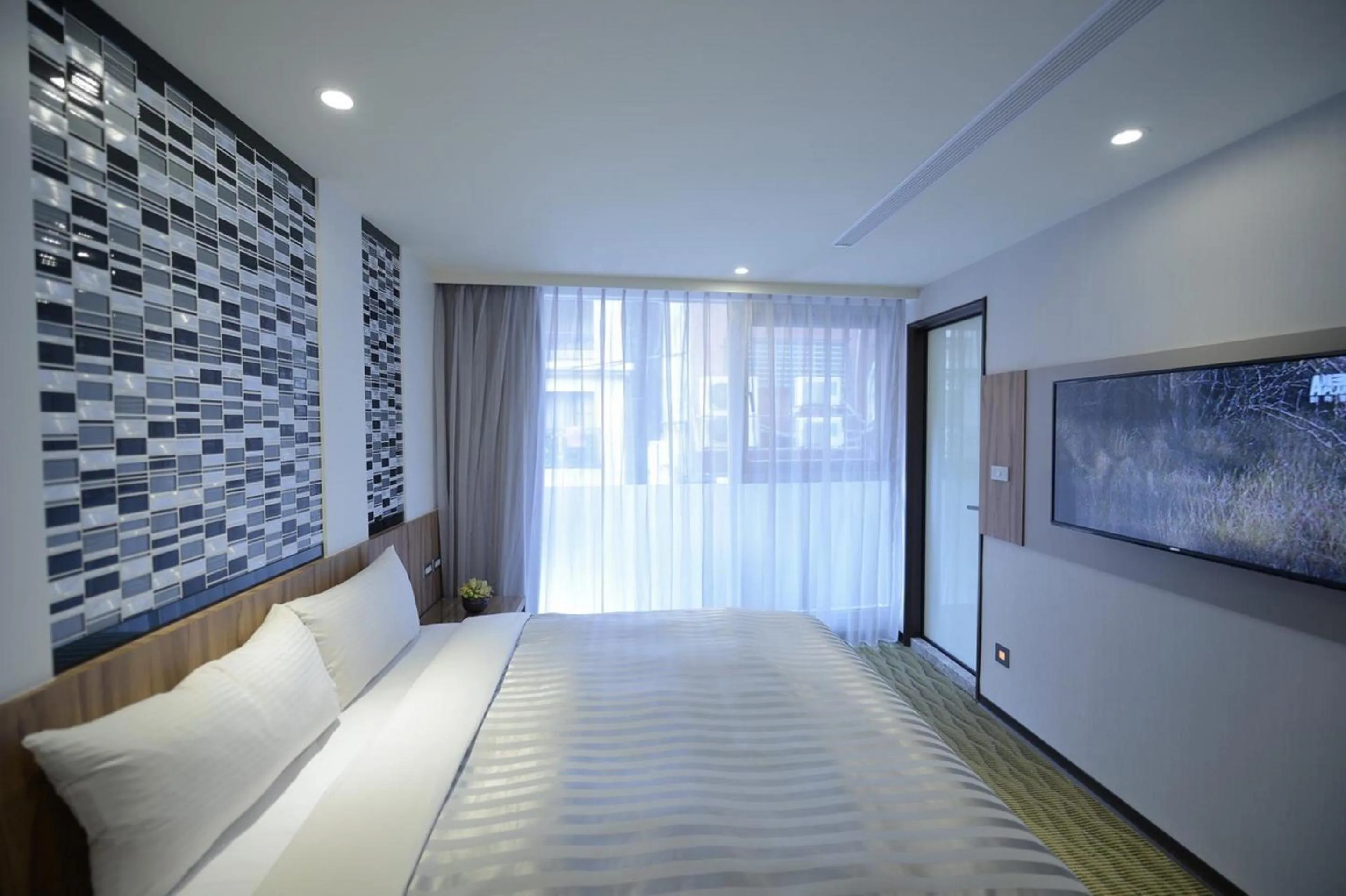 Bed in 西門大飯店 Ximen Hotel