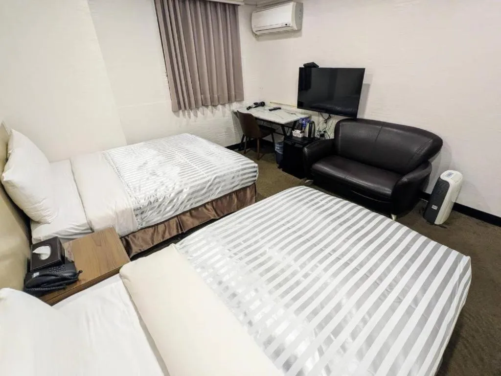Bed in 西門大飯店 Ximen Hotel