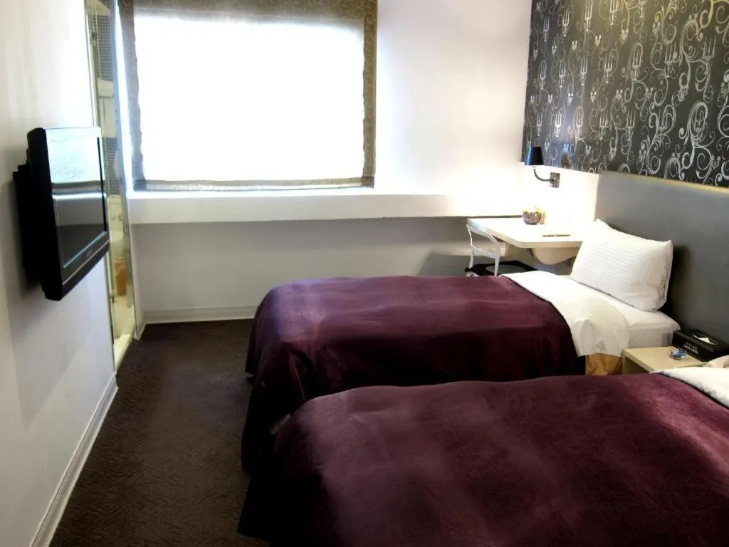 Bed in 西門大飯店 Ximen Hotel