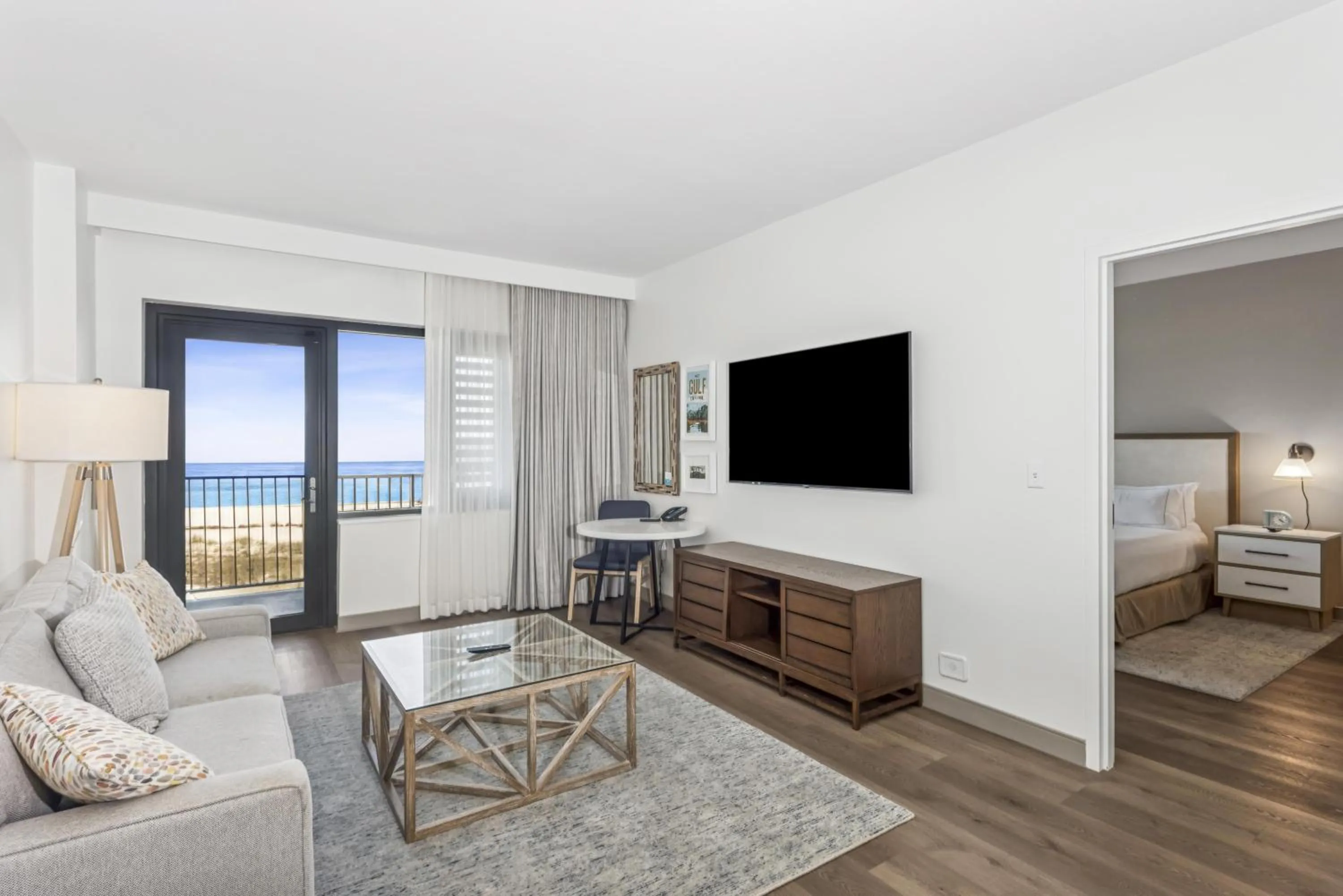 Living room, Bed in The Lodge at Gulf State Park, A Hilton Hotel