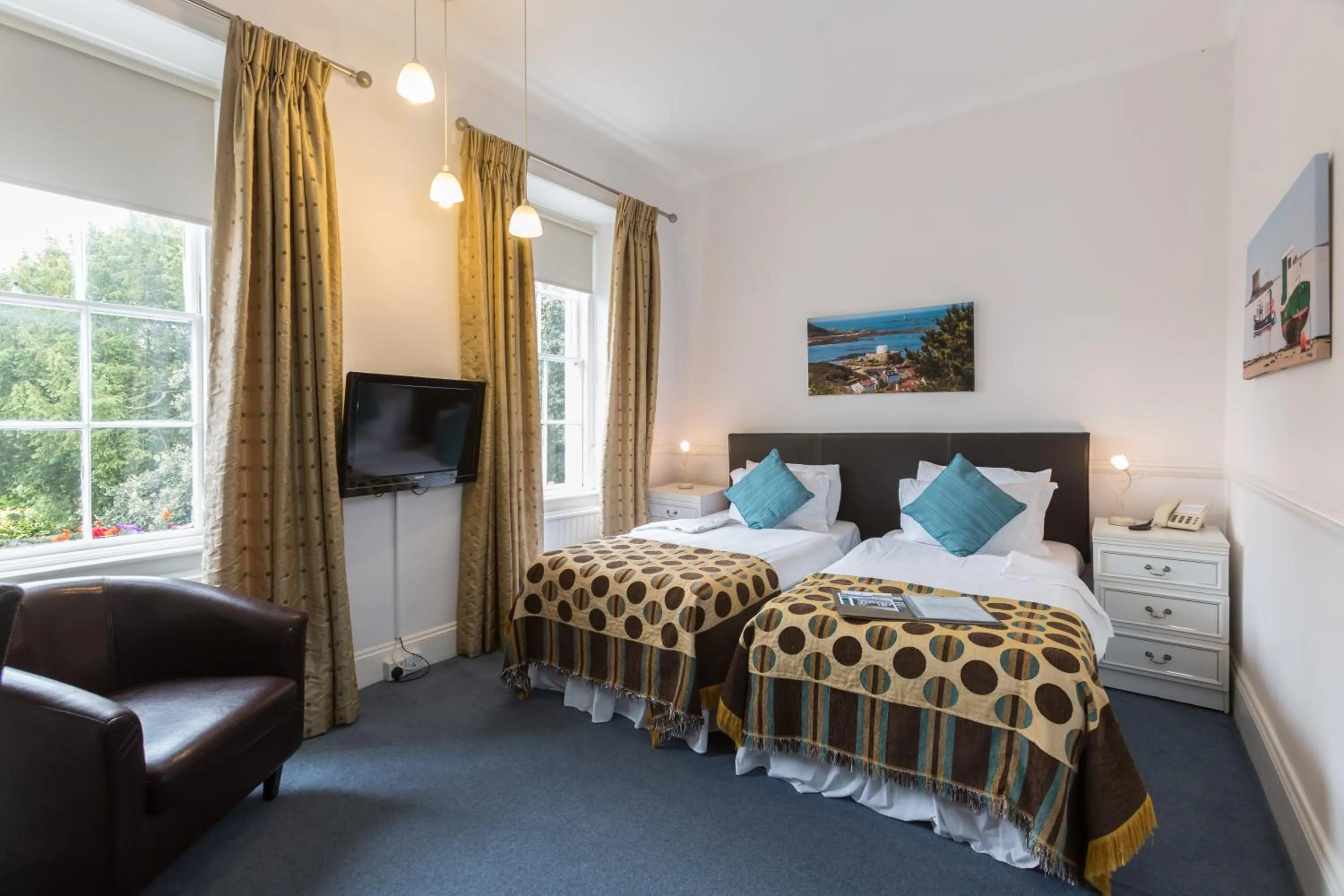 Bed in La Collinette Hotel, Cottages & Apartments