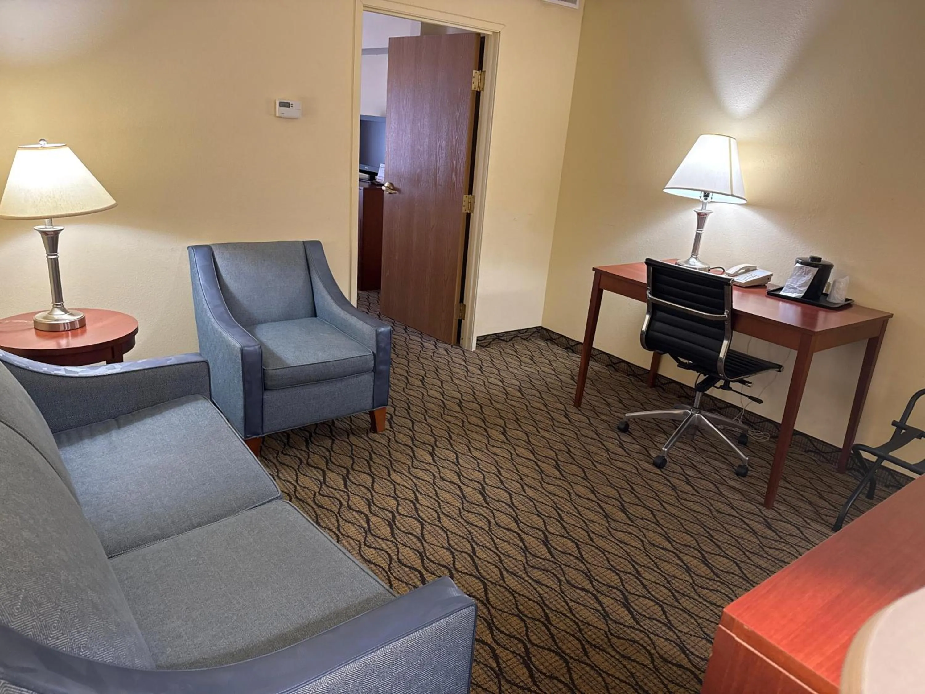 Living room in Baymont by Wyndham Mishawaka South Bend Area