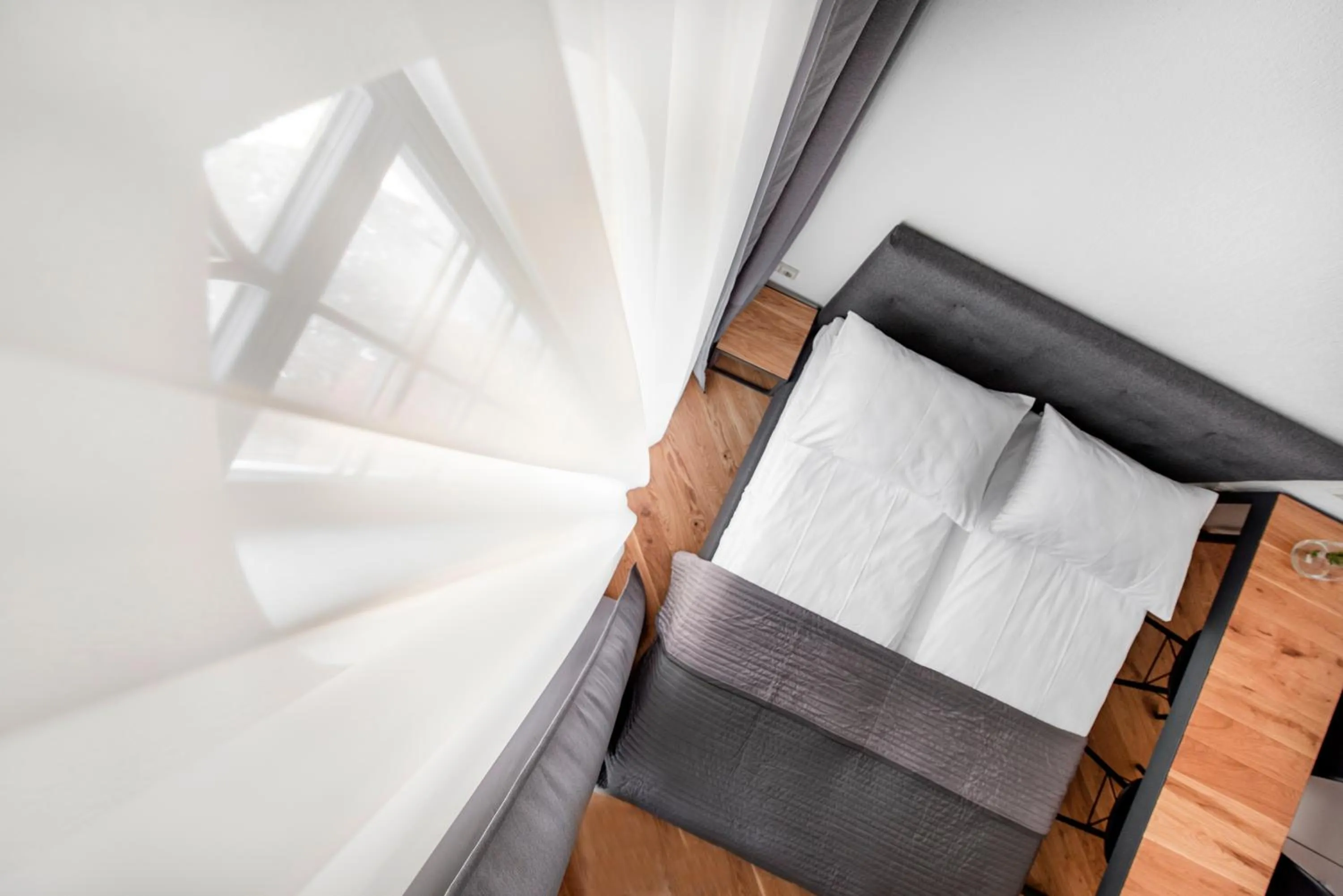 Bed in Piano Apartments