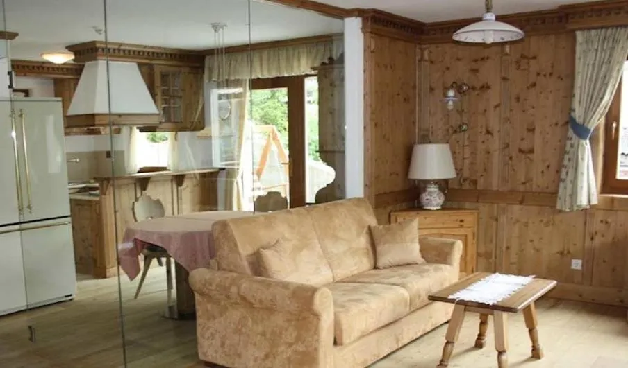 Communal lounge/ TV room in Family and Wellness Residence Ciasa Antersies