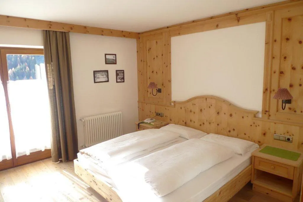 Bed in Family and Wellness Residence Ciasa Antersies