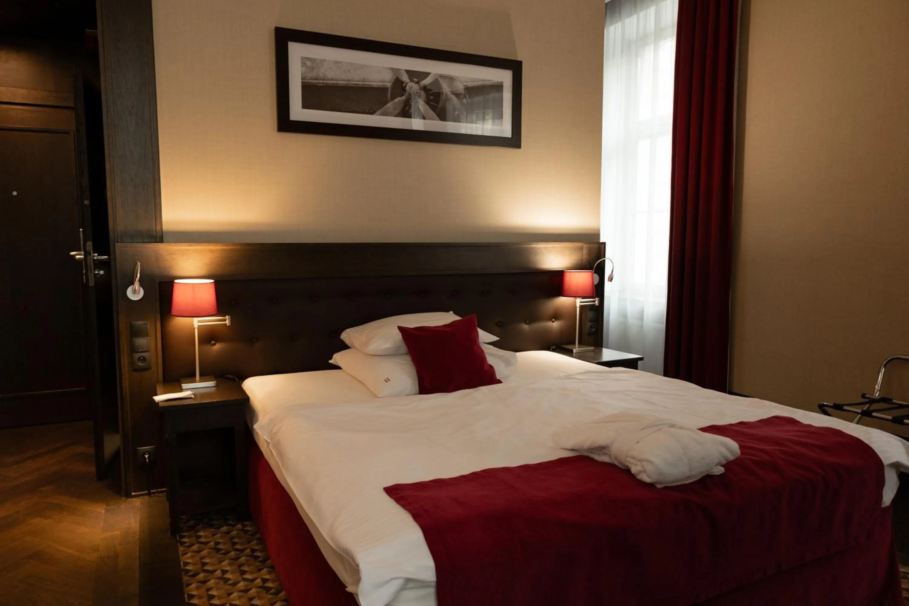 Bed in Red Baron Hotel & Restaurant