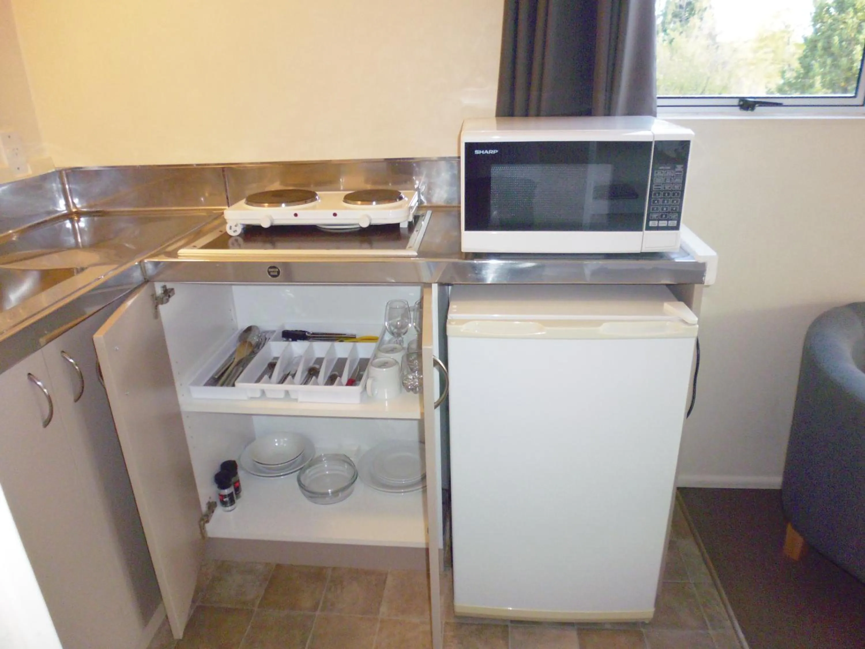 Kitchen or kitchenette in Spa Lodge Motel