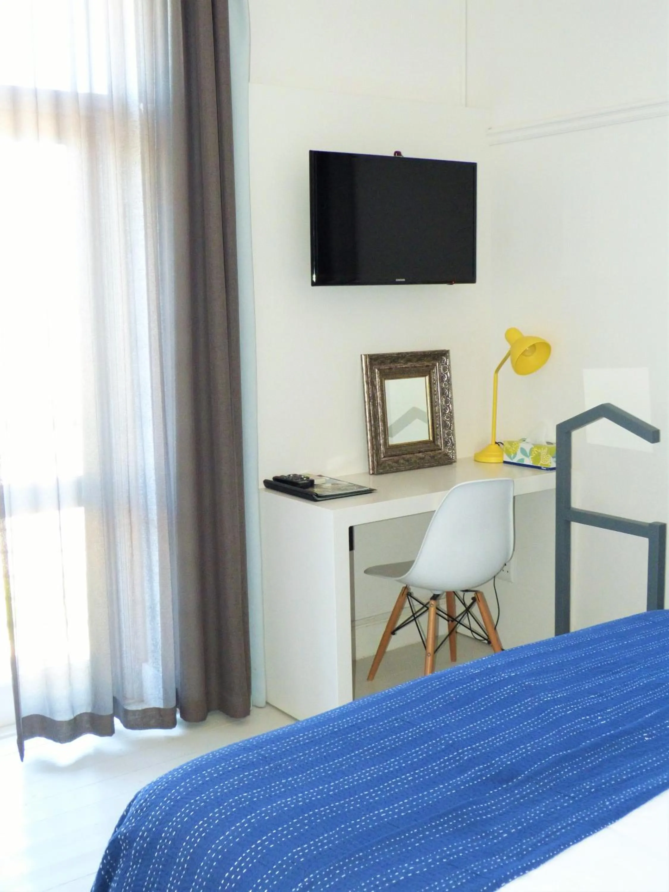 Bed in The Hampton Exclusive Guesthouse