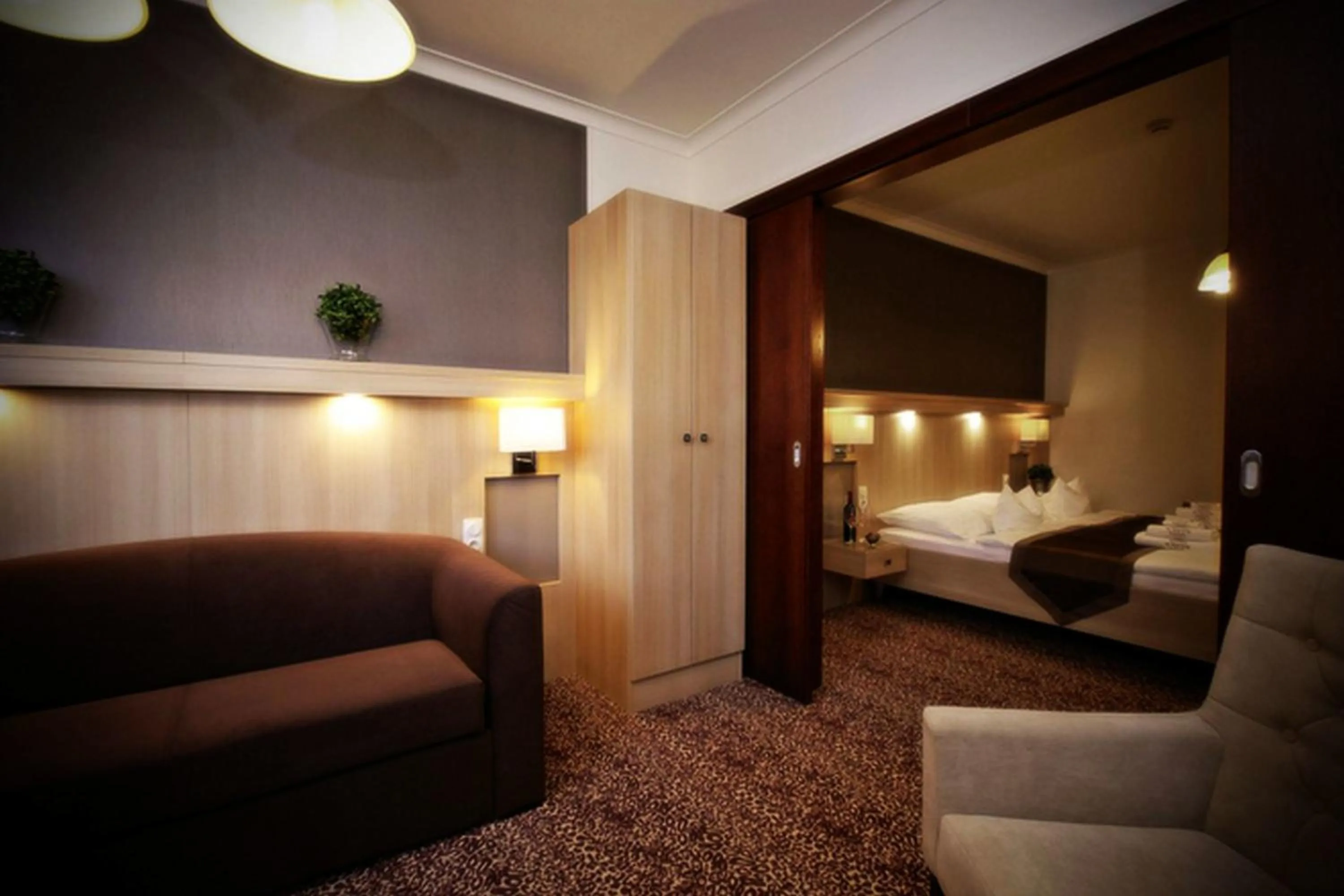Bed in Xavin Wellness Hotel & Restaurant