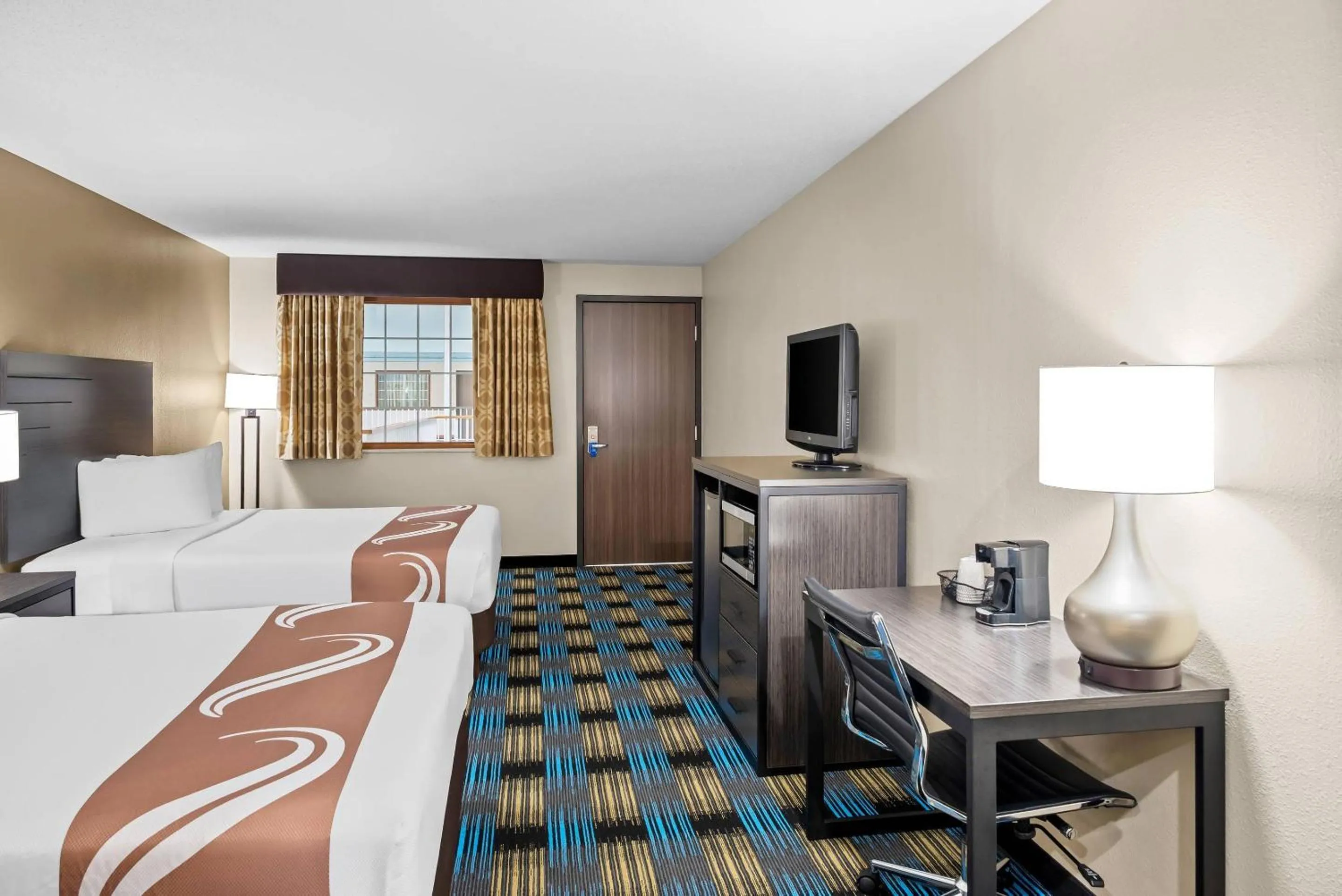 Bedroom, Bed in Rodeway Inn Grandville - Grand Rapids