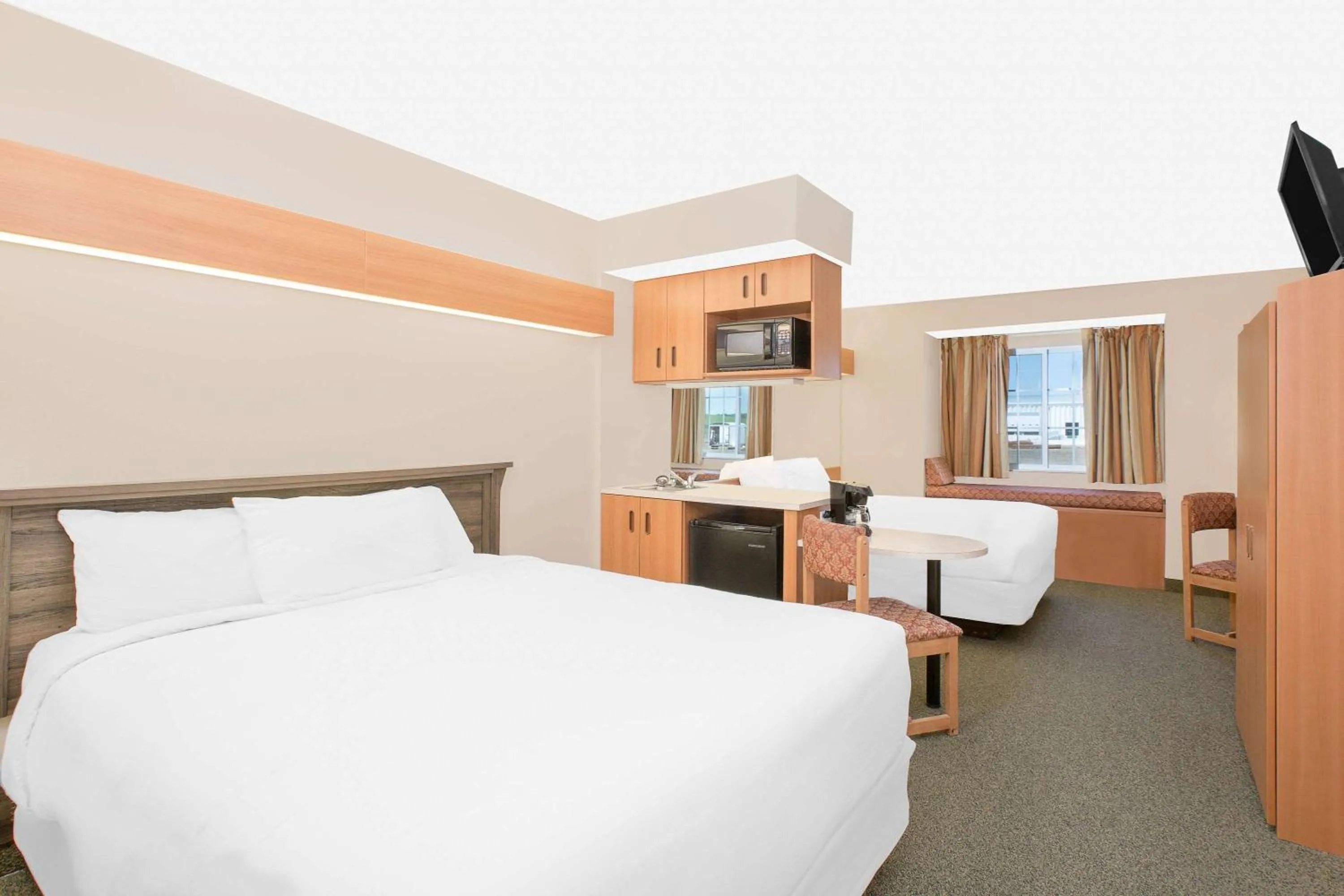 Photo of the whole room, Bed in Microtel Inn & Suites by Wyndham Colfax