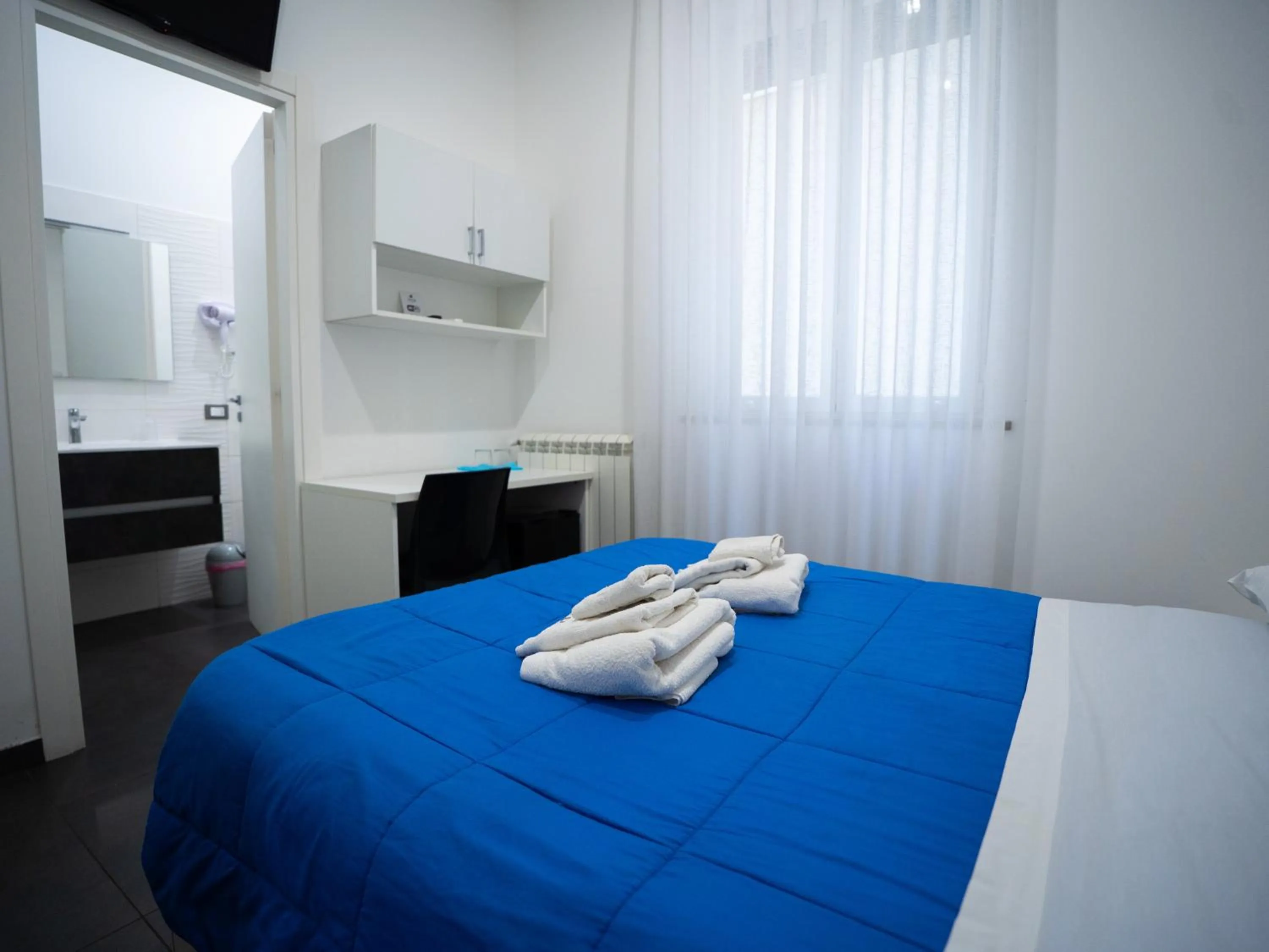 Bed in Amuri Room&Suite