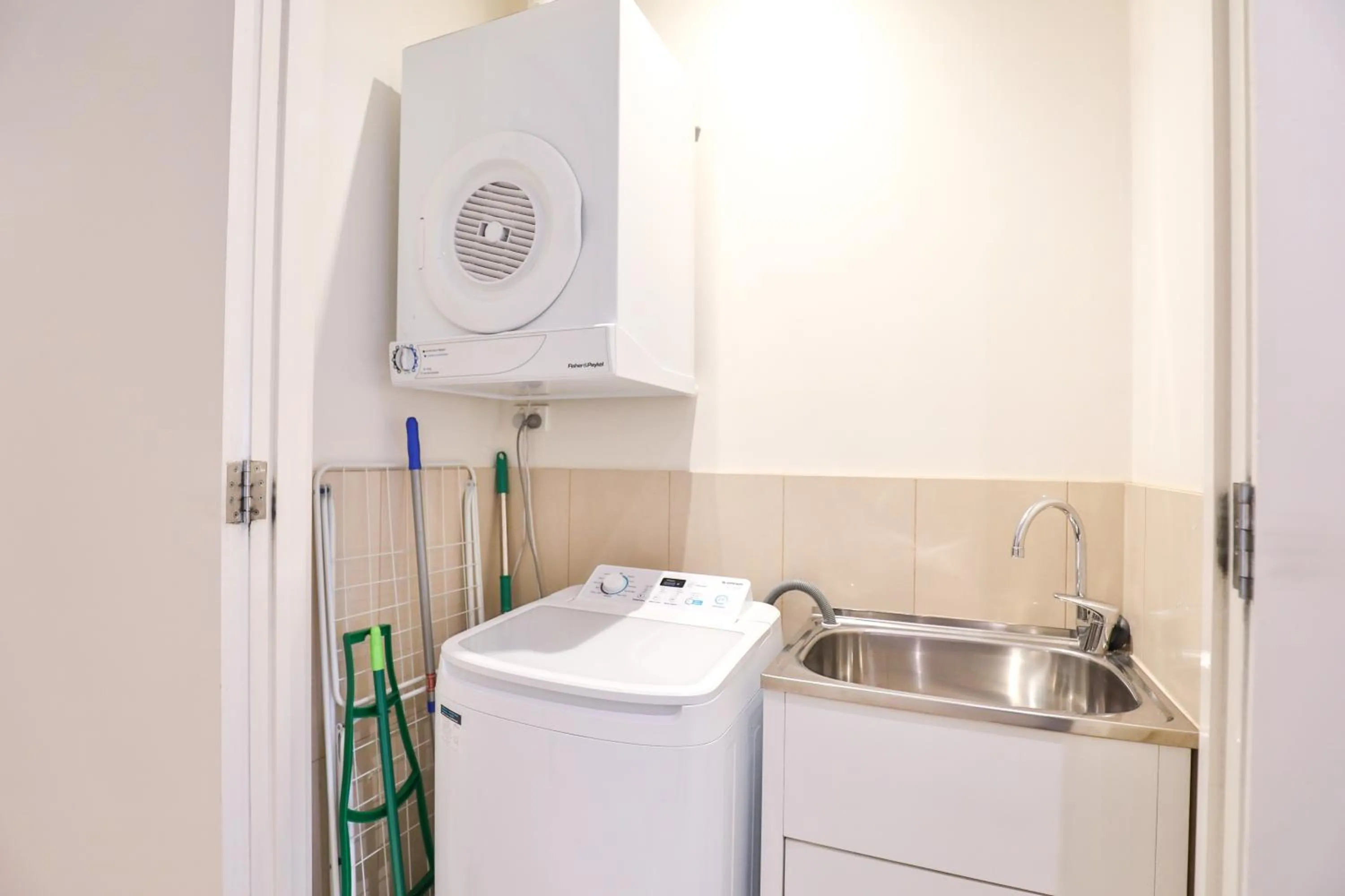 washing machine in Indulge Apartments - Langtree