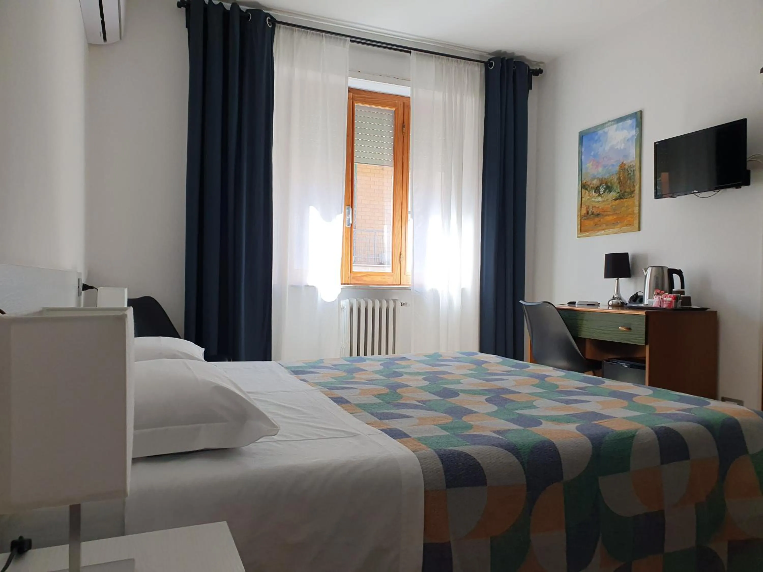 Bed in Hotel Cormorano