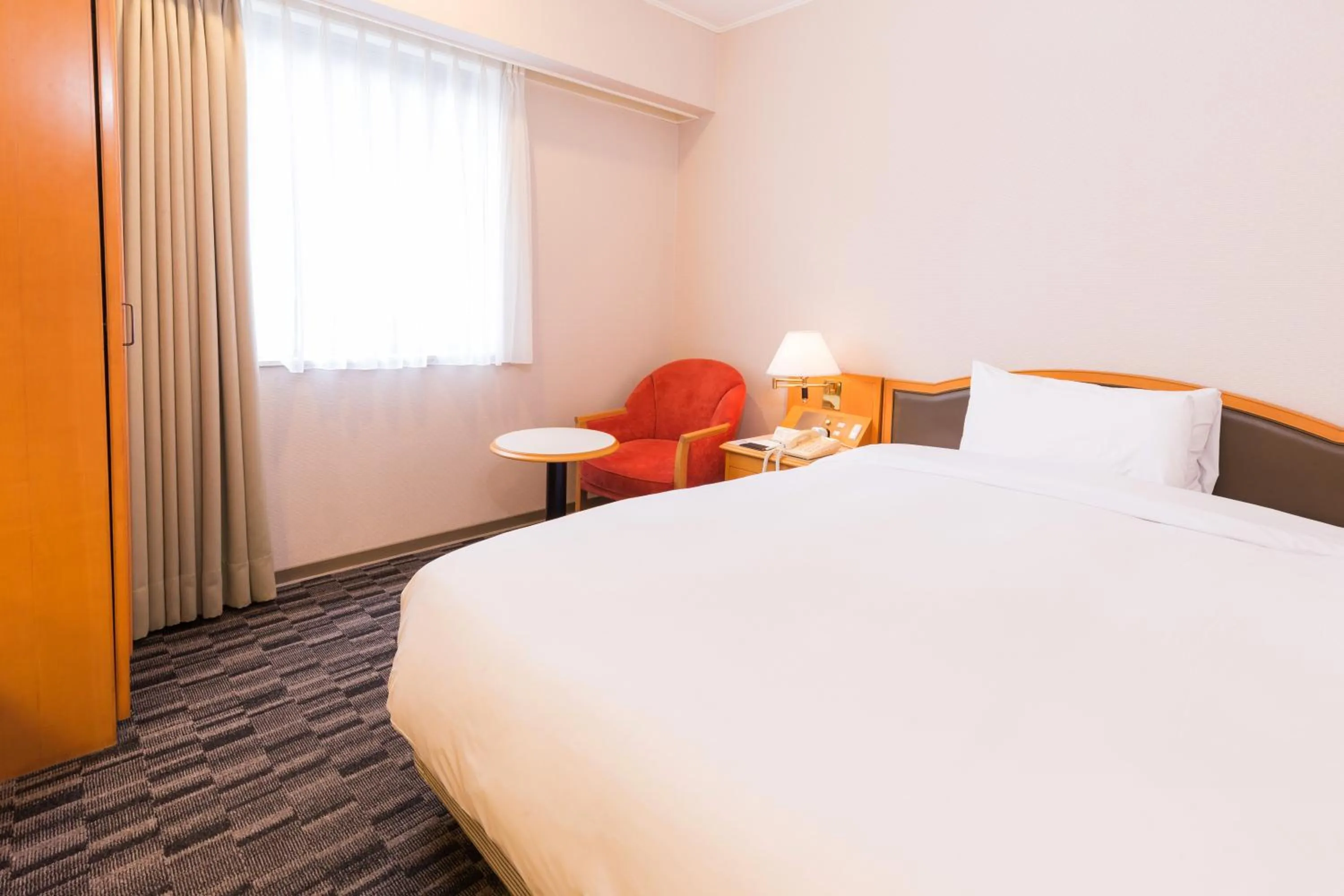 Bed in Hotel Sunroute Taipei