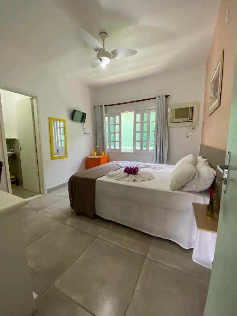 Bed in Pousada Liras da Poesia