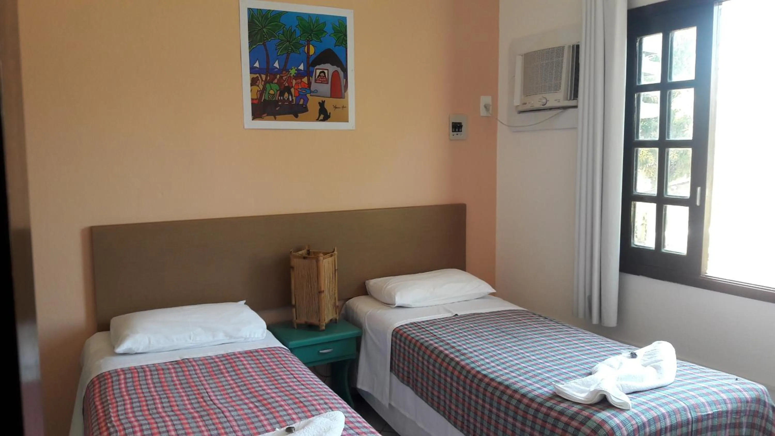 Bed in Pousada Liras da Poesia