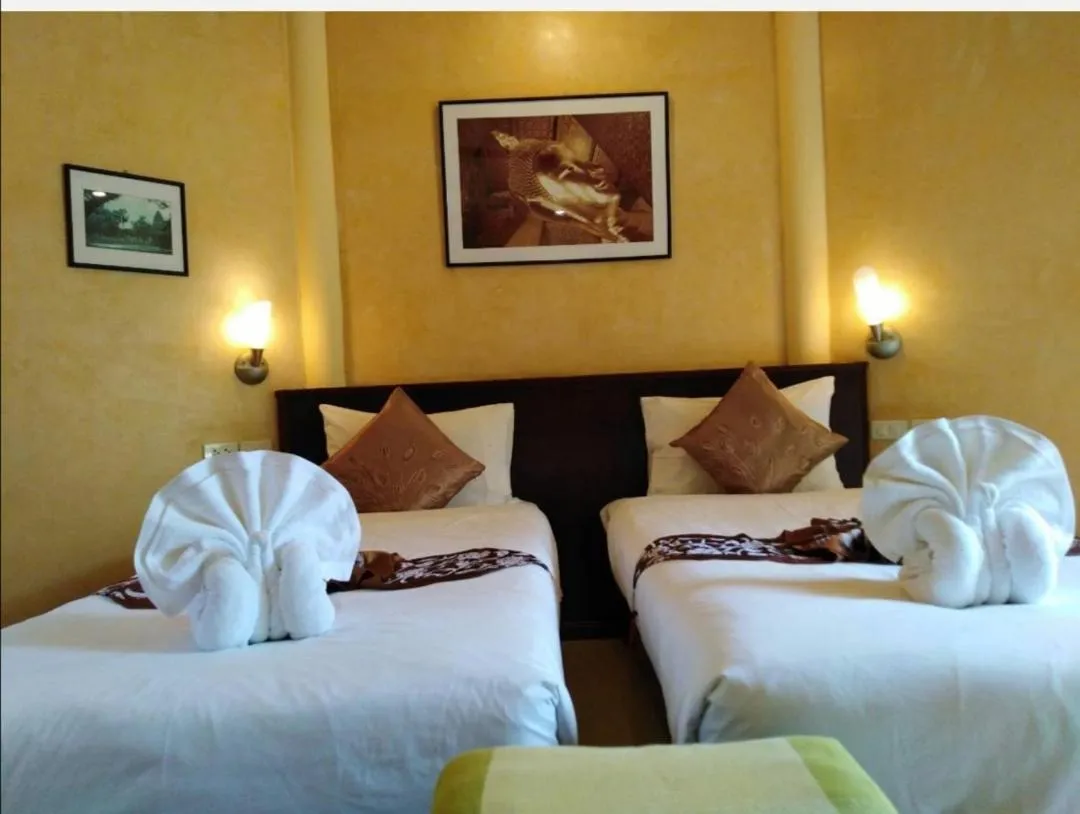 Bed in Palm Garden Resort