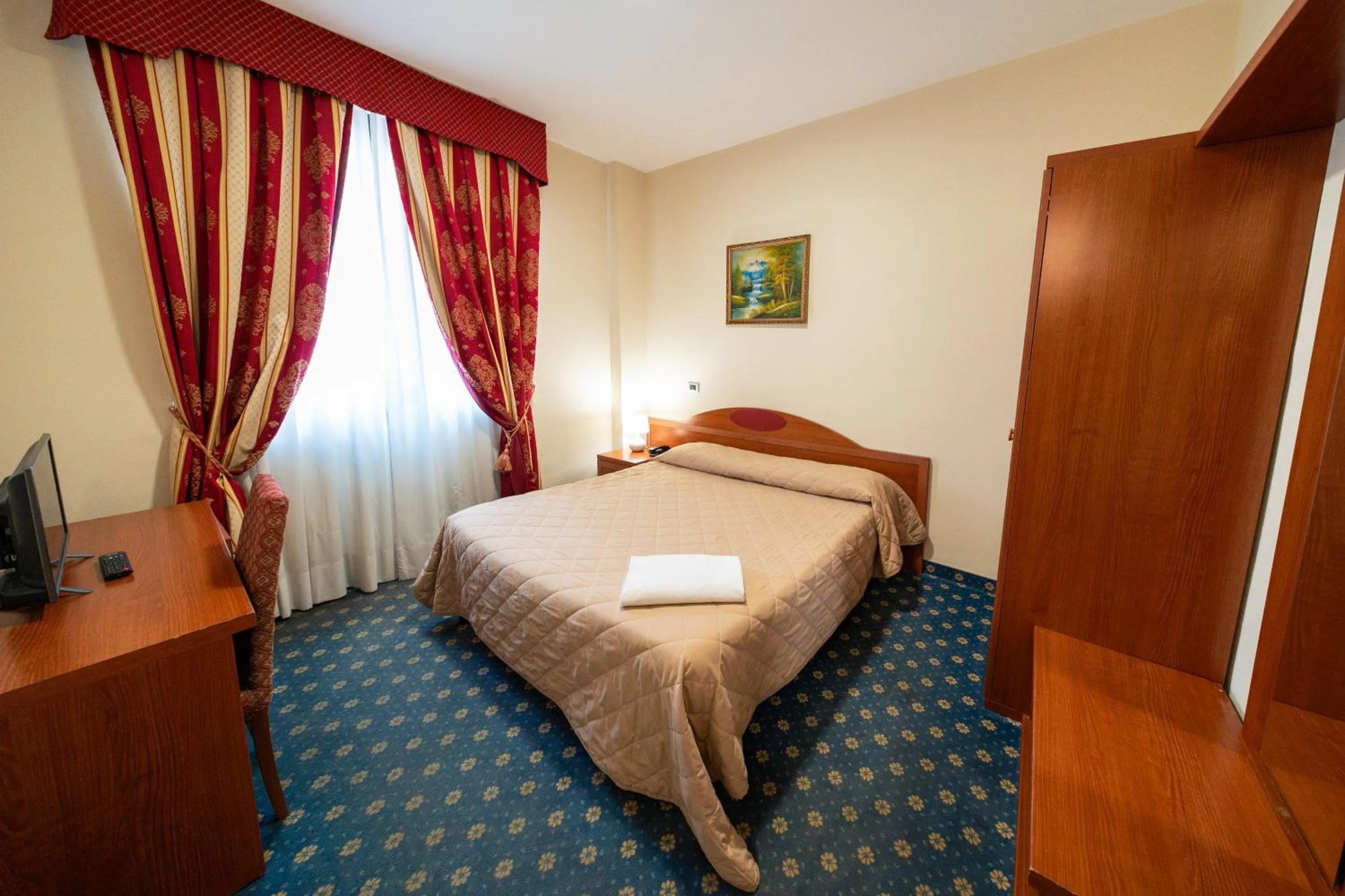 Bed in Hotel Cavour Resort