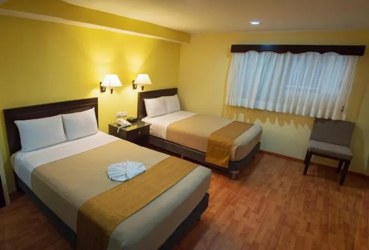 Bed in Hotel Madan Cárdenas