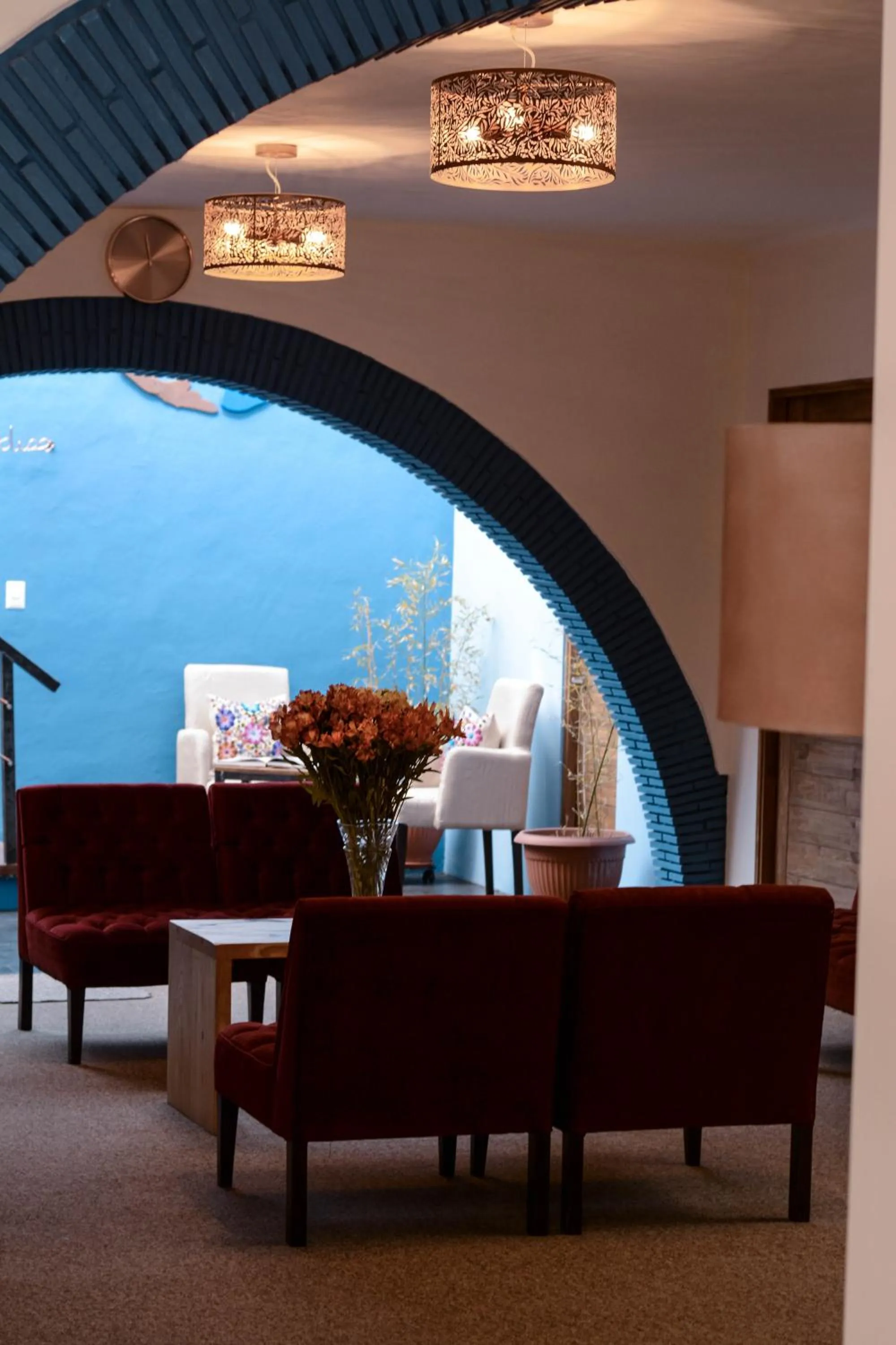 Communal lounge/ TV room in Cooper Hotel Boutique