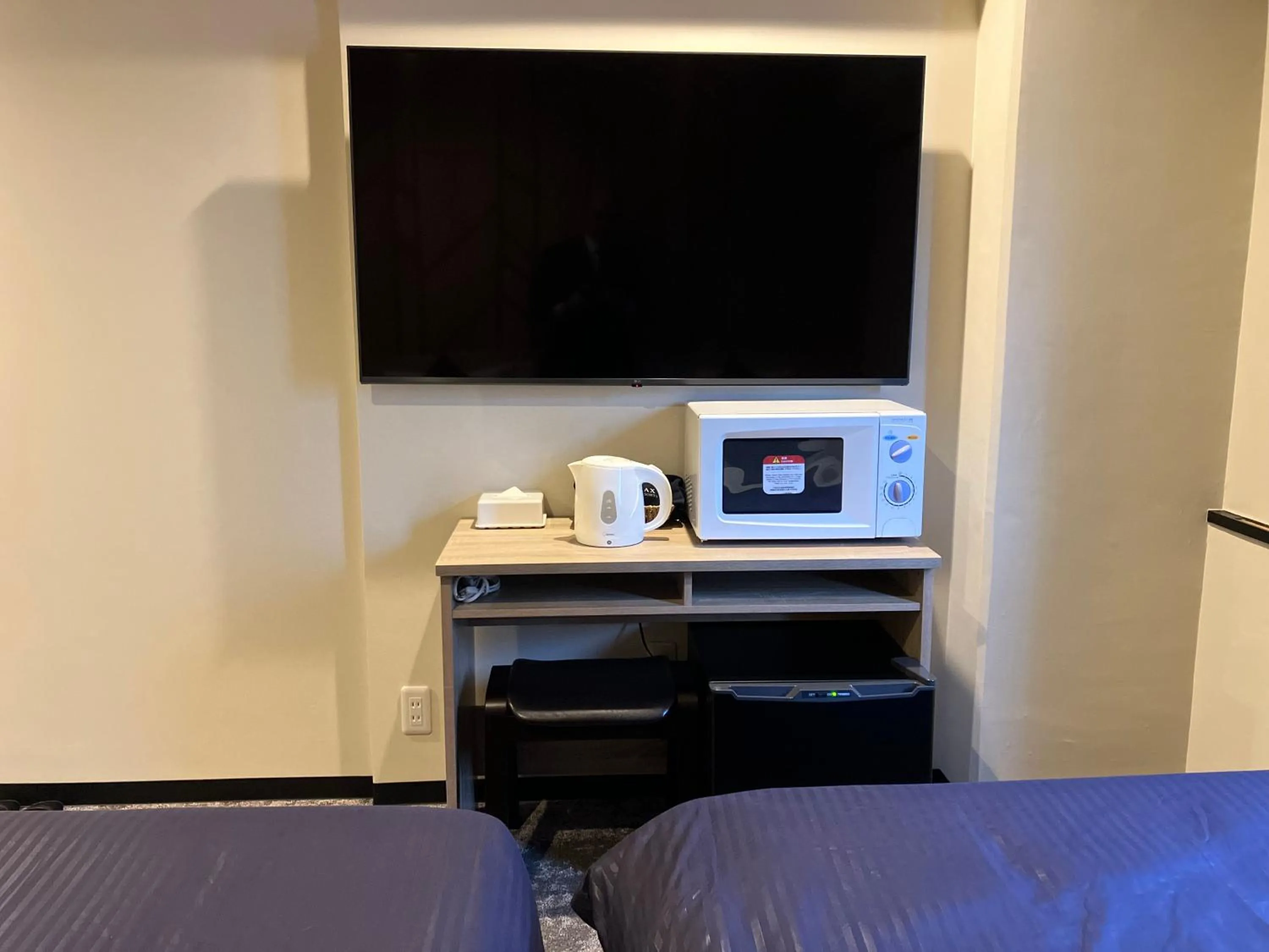 Bed in HOTEL LiVEMAX BUDGET Naha