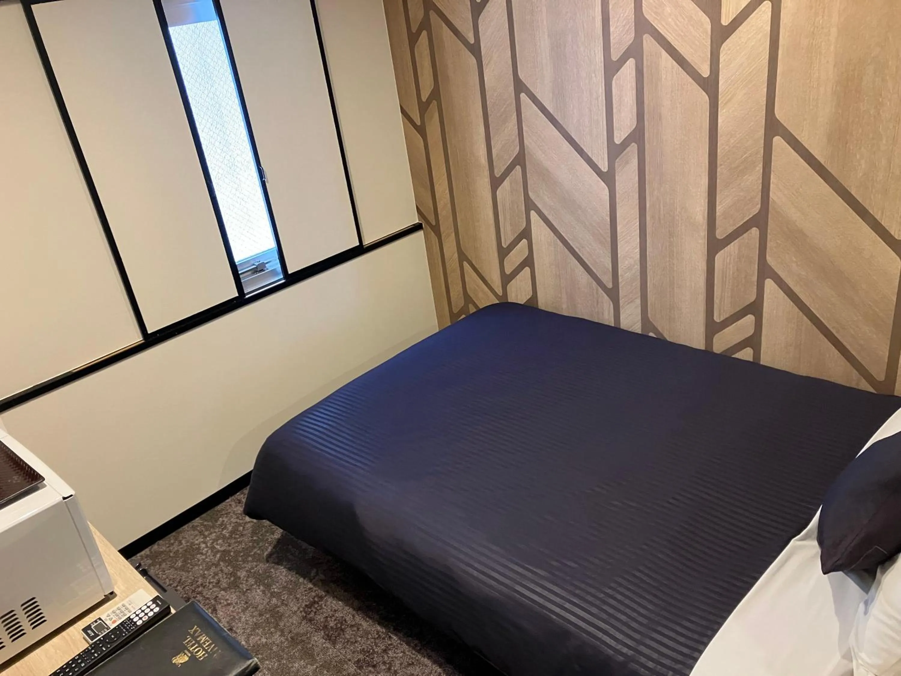 Bed in HOTEL LiVEMAX BUDGET Naha