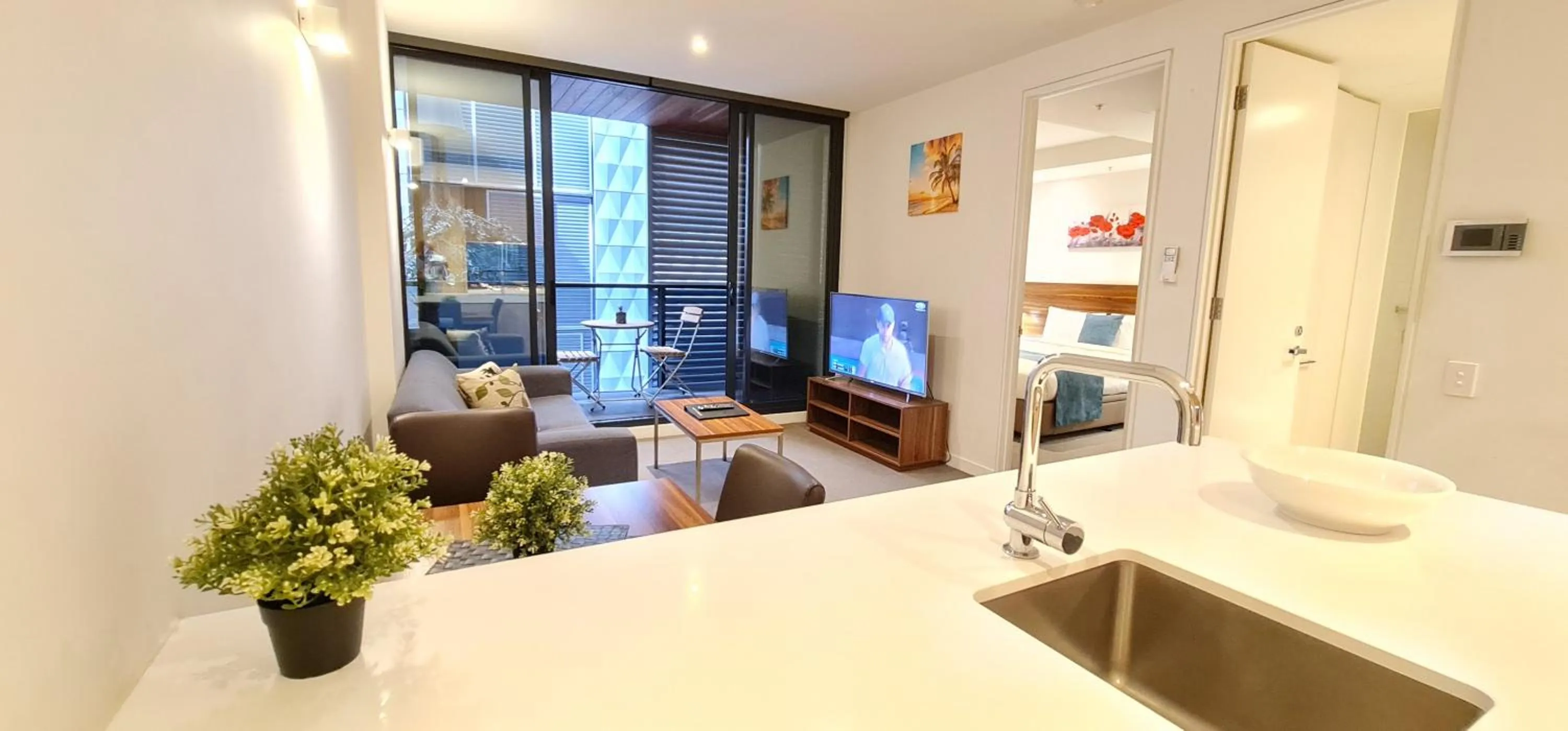 Living room, Bed in Flinders Street Apartments Melbourne CBD