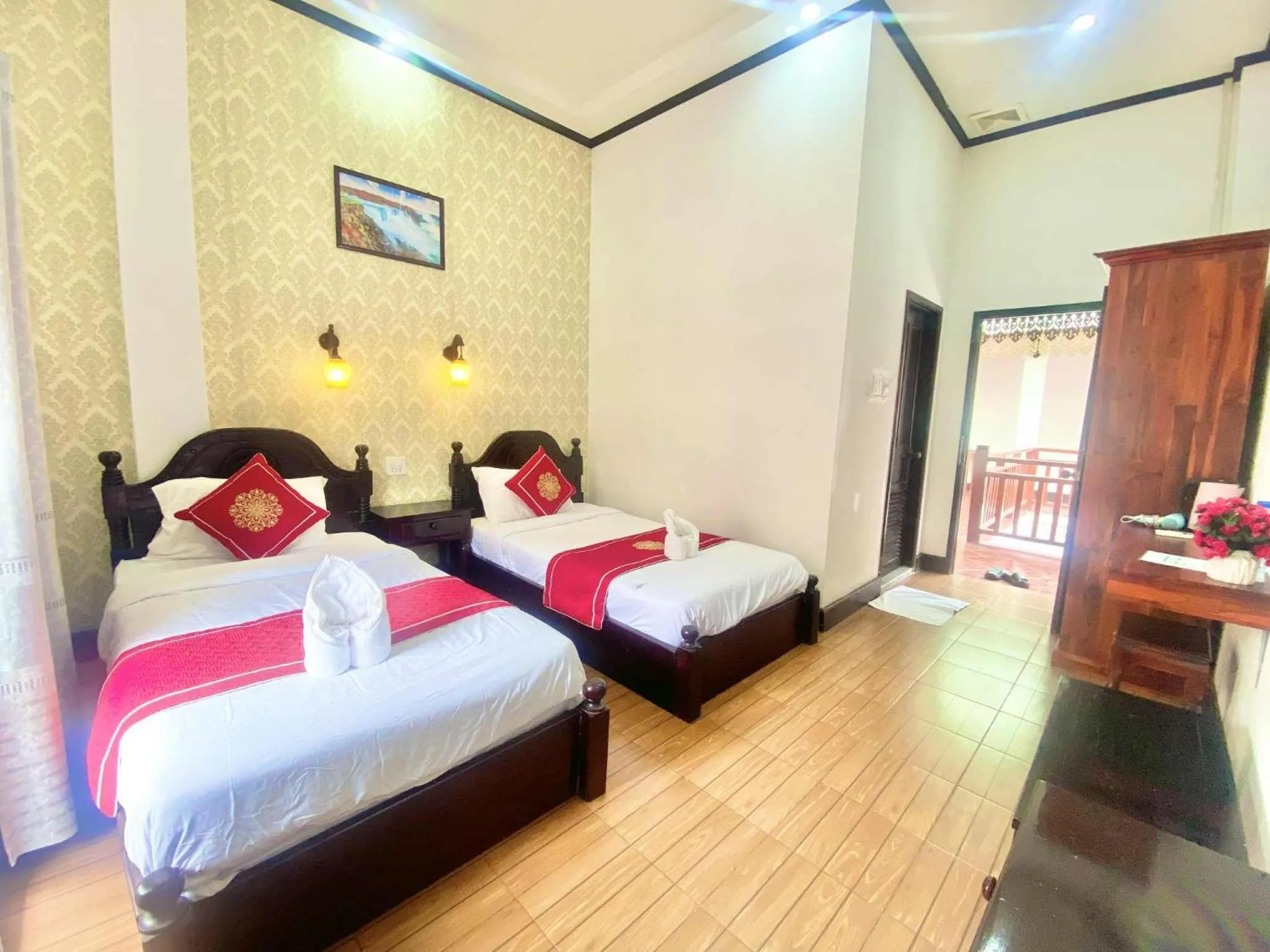 Bed in Luang Prabang Pavilion Hotel & Travel