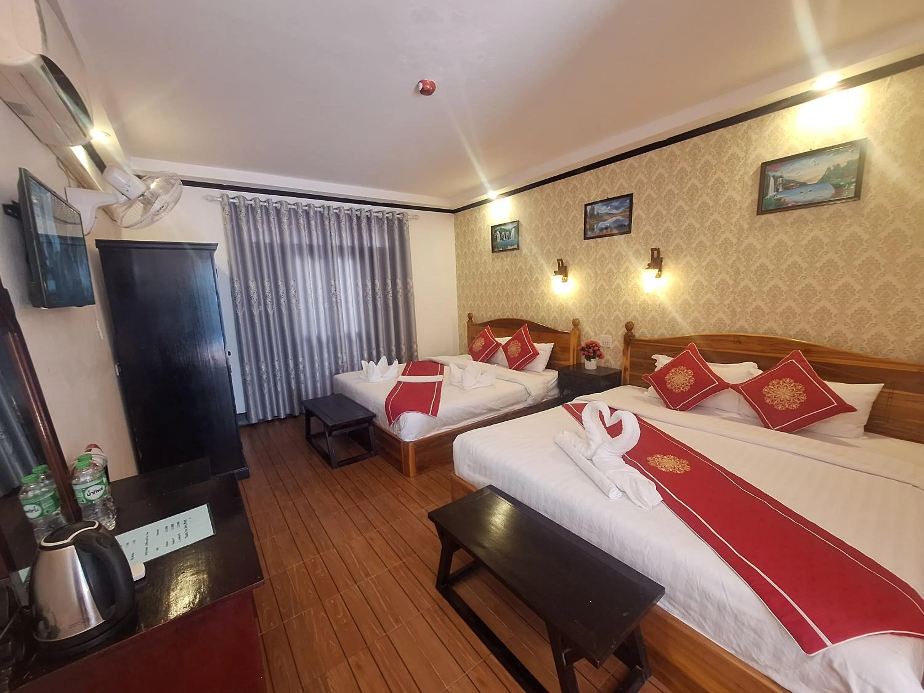 Bed in Luang Prabang Pavilion Hotel & Travel