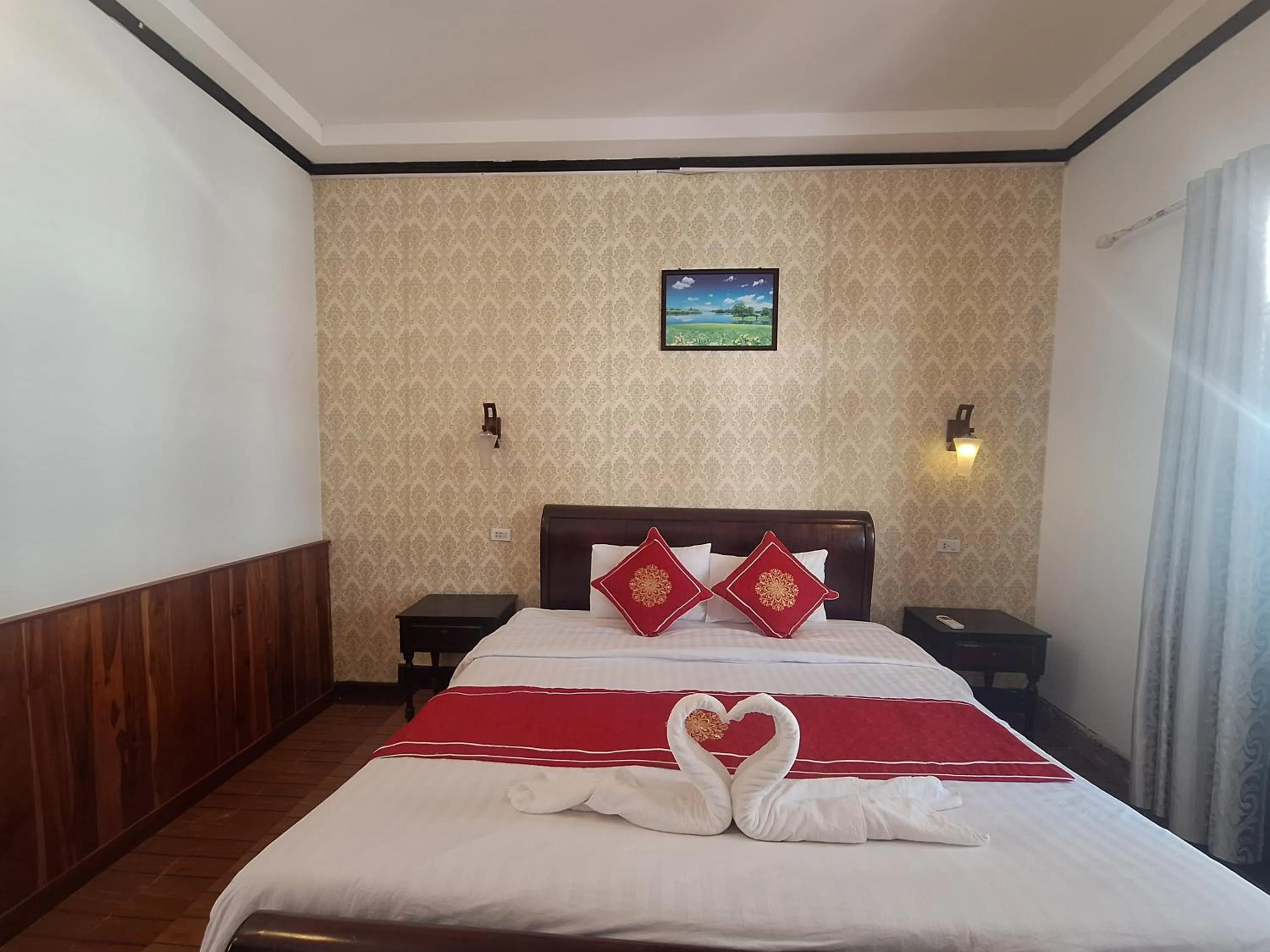 Bed in Luang Prabang Pavilion Hotel & Travel