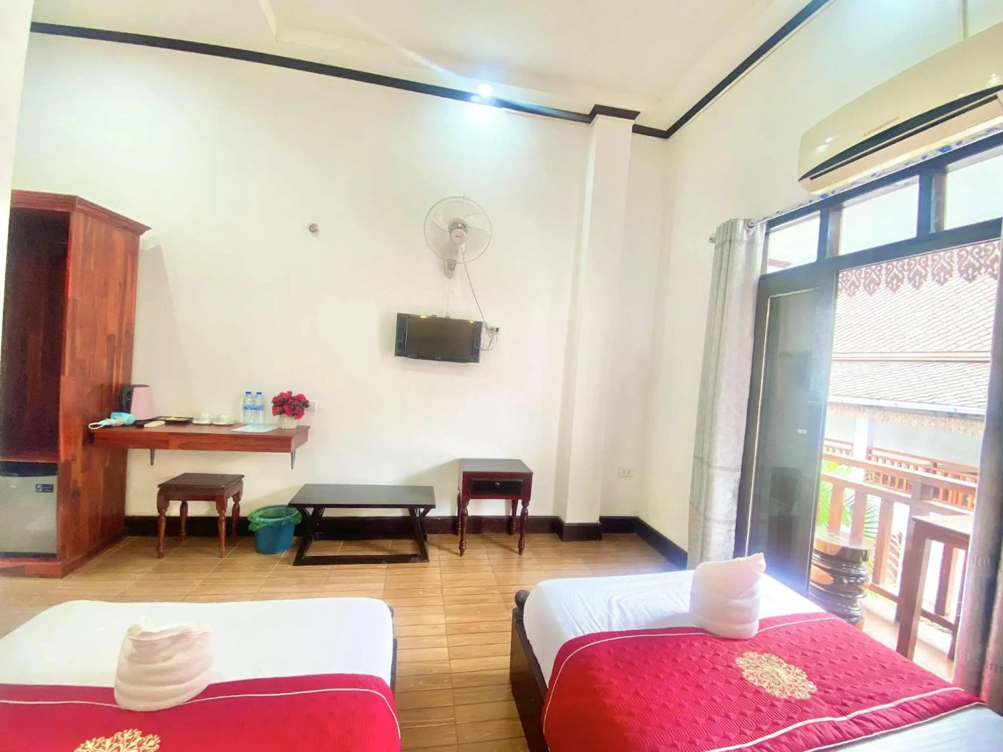 Bed in Luang Prabang Pavilion Hotel & Travel