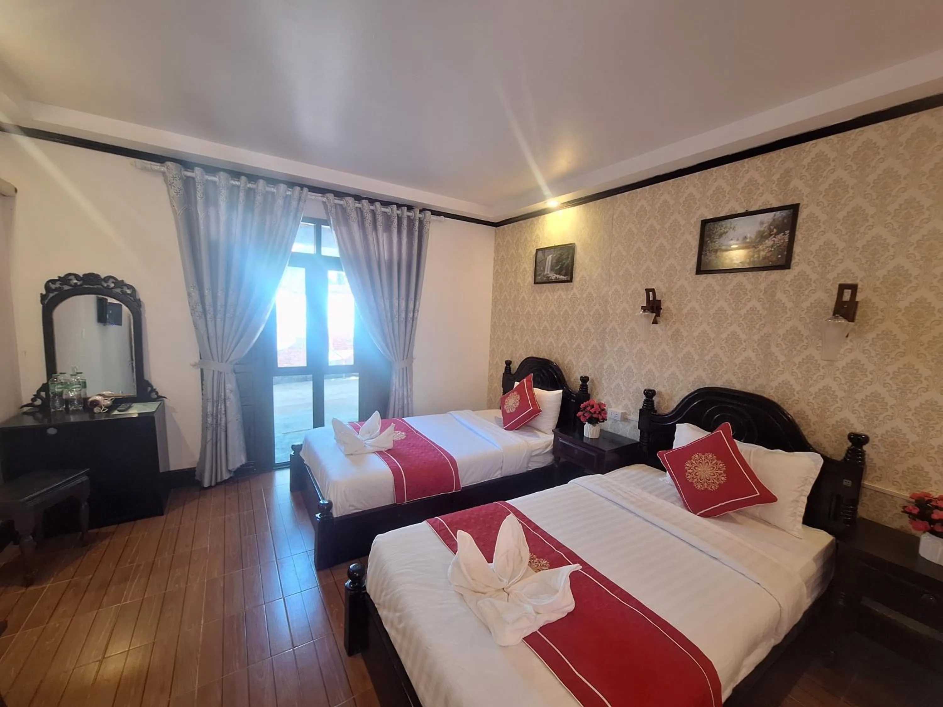 Bed in Luang Prabang Pavilion Hotel & Travel