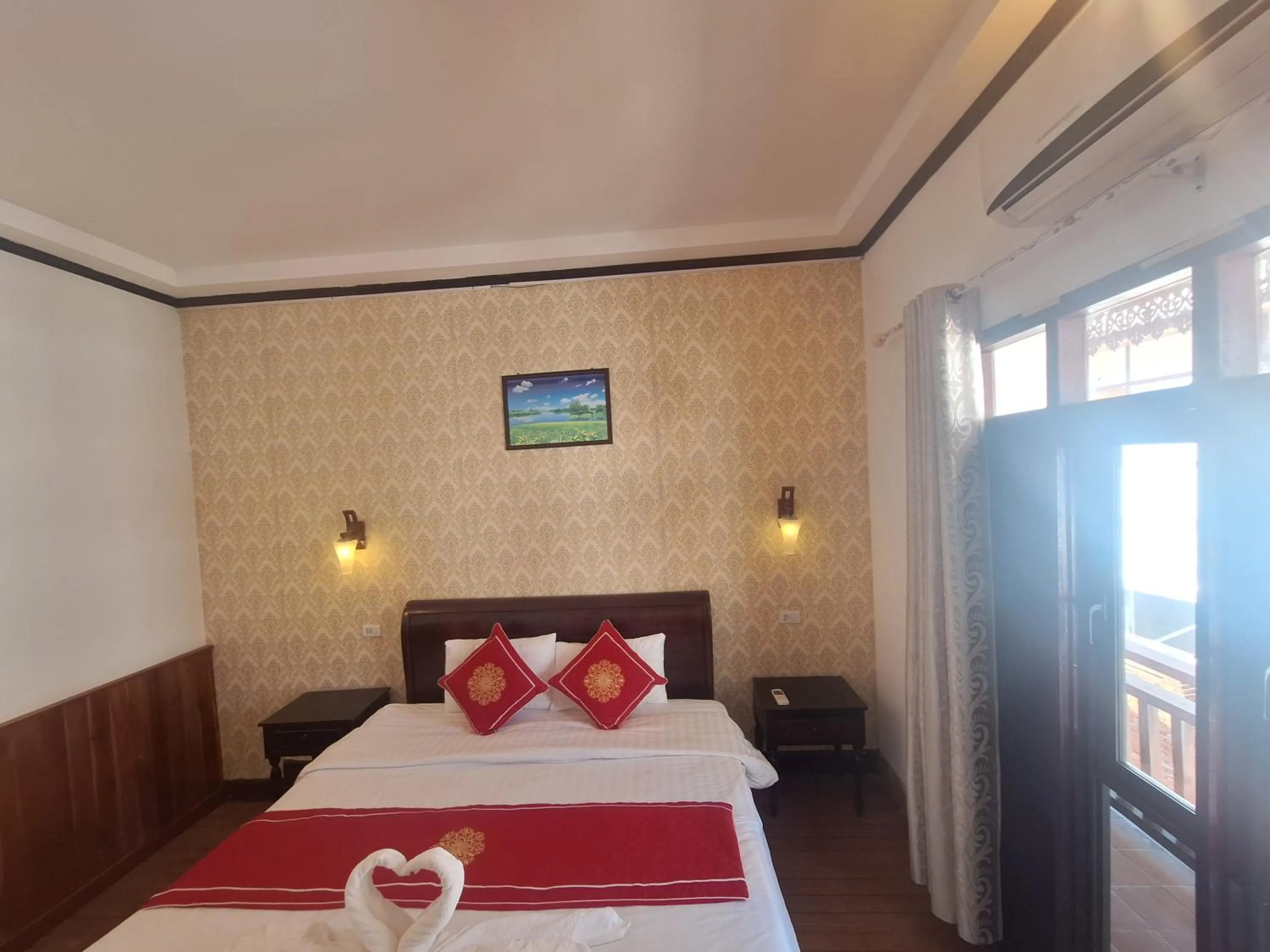 Bed in Luang Prabang Pavilion Hotel & Travel