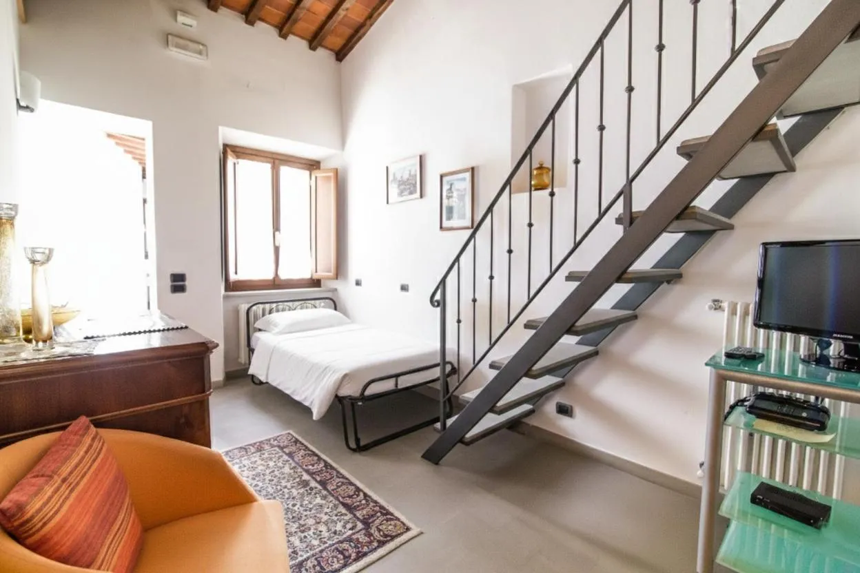 Bed in La Corte Del Re Suite & Rooms Arezzo