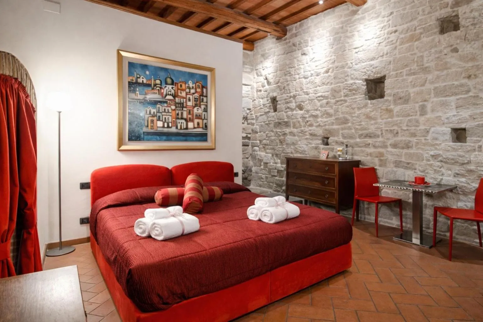 Bed in La Corte Del Re Suite & Rooms Arezzo