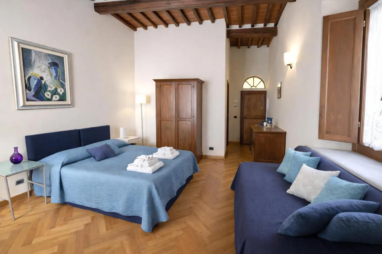 Bed in La Corte Del Re Suite & Rooms Arezzo