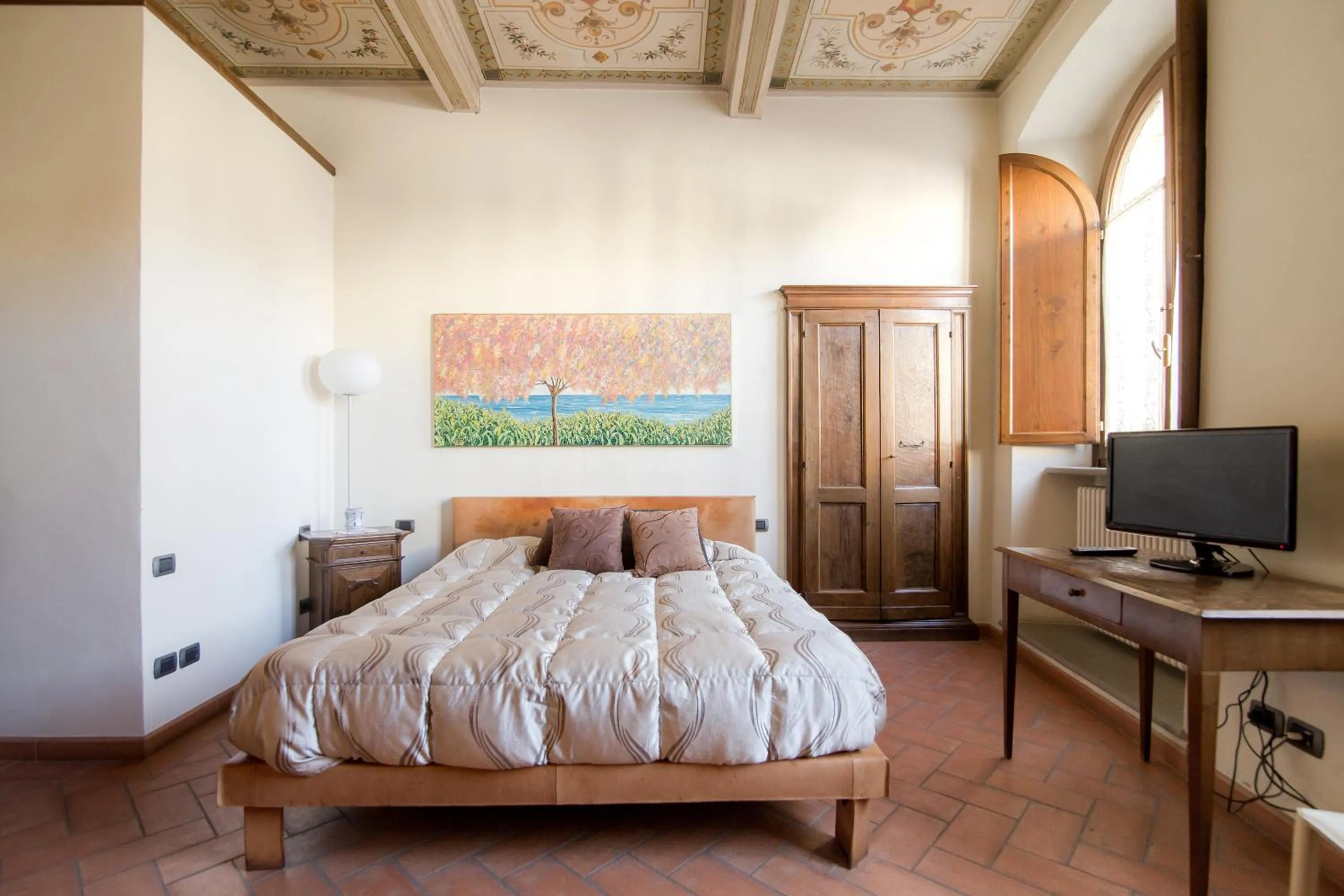 Bed in La Corte Del Re Suite & Rooms Arezzo