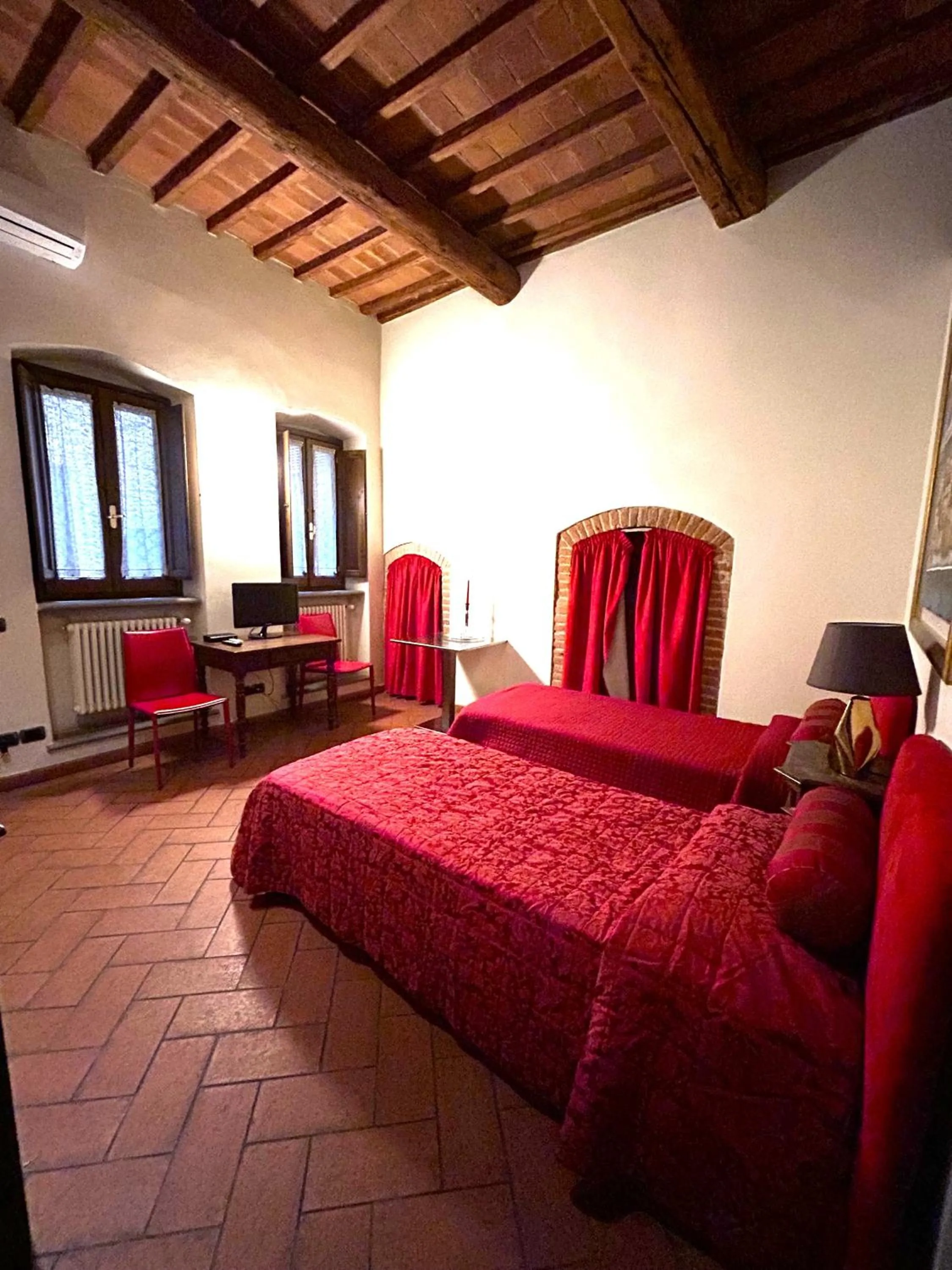 Seating area, Bed in La Corte Del Re Suite & Rooms Arezzo