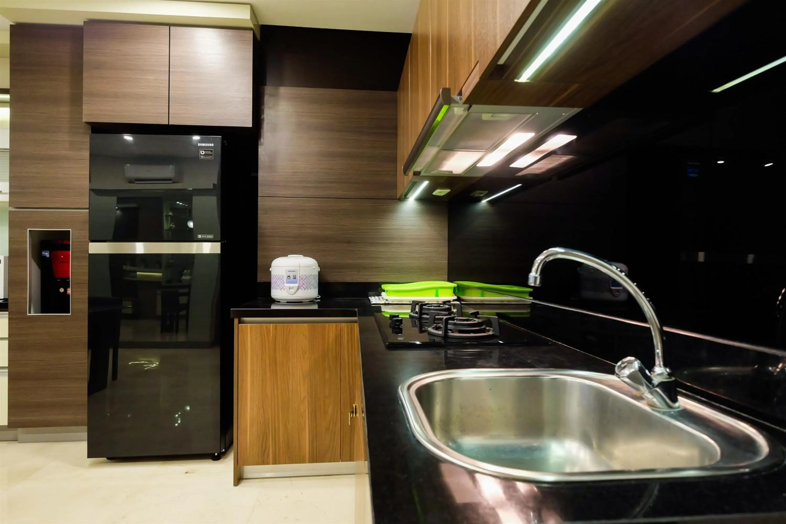 Kitchen or kitchenette in Modern Elegant Design 2BR L'Avenue Apartment By Travelio