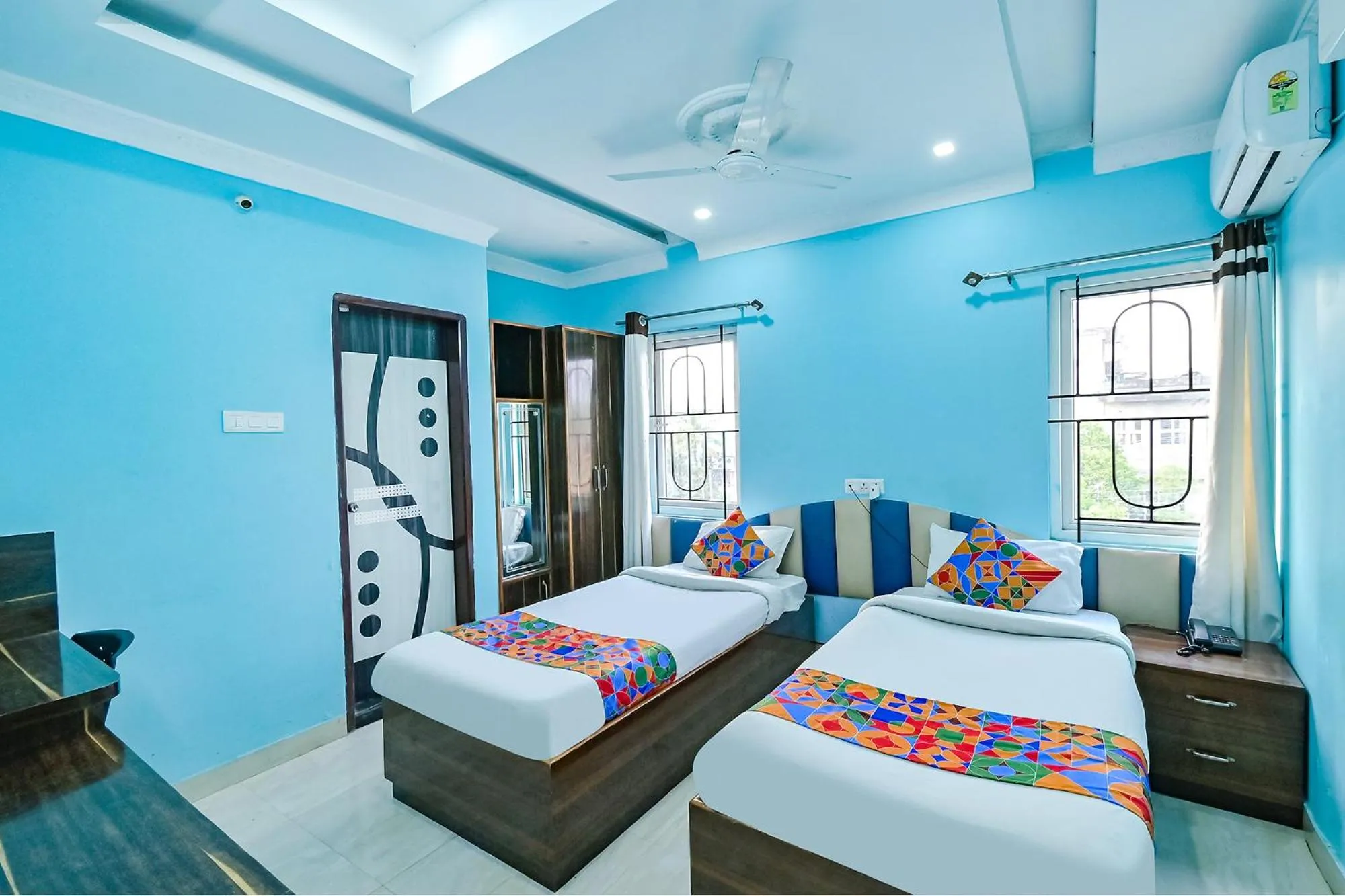 Bed in FabHotel Good Luck Residency