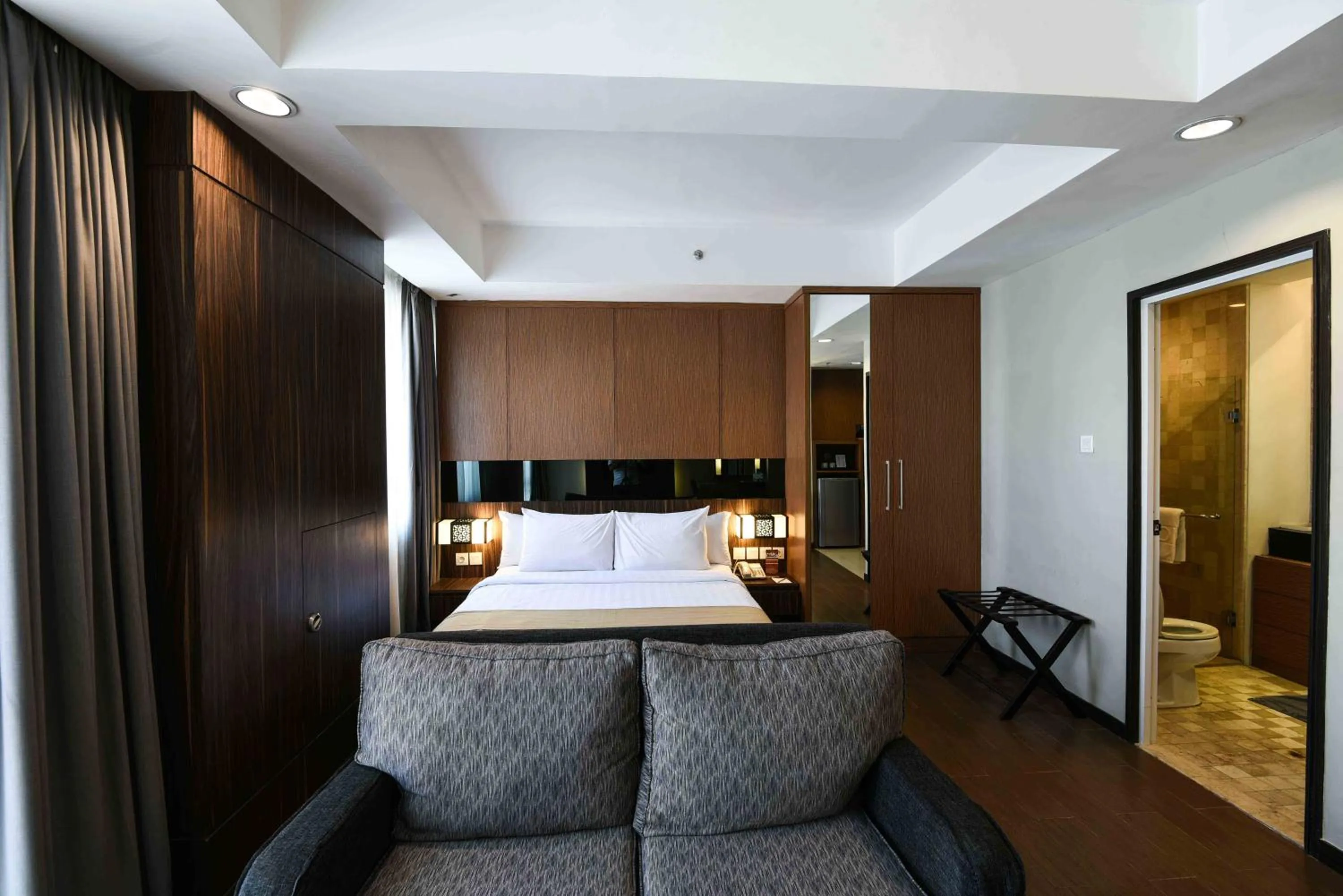 Bed in The Malibu Suites Balikpapan by Sissae Living