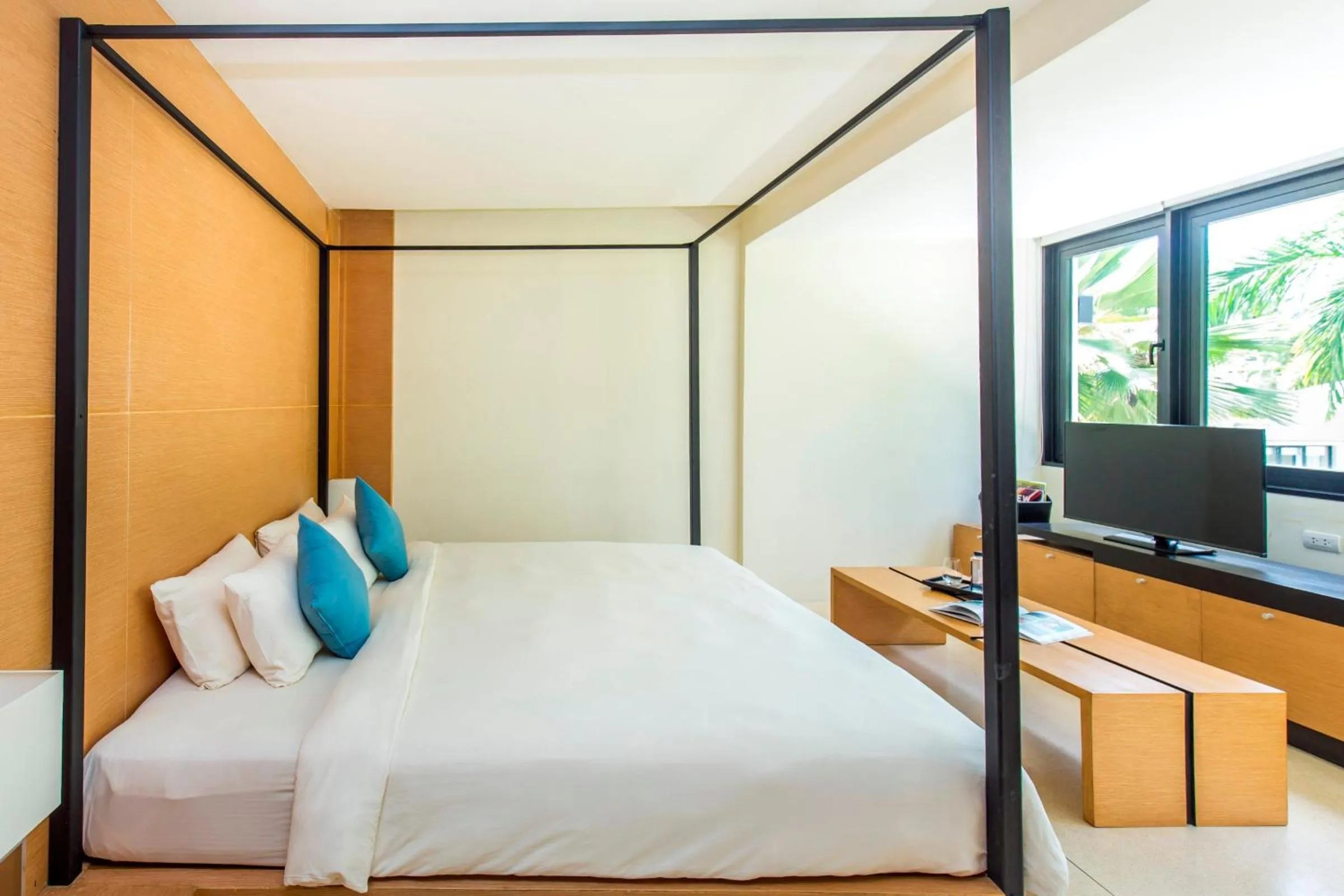 Bed in The Anda Mani Khaolak Beachfront Villas