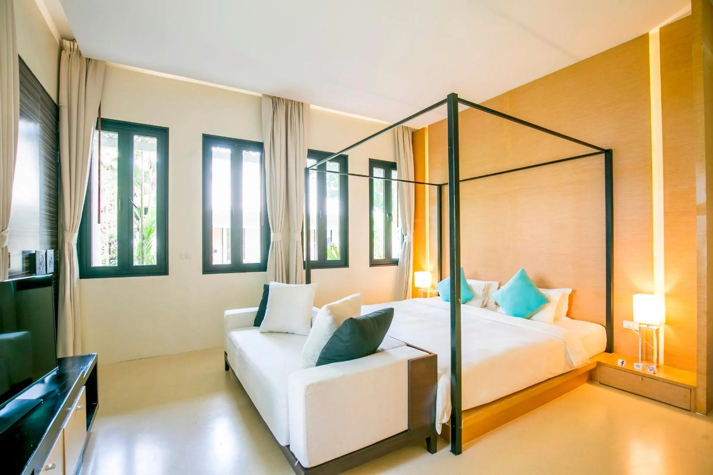 Bed in The Anda Mani Khaolak Beachfront Villas