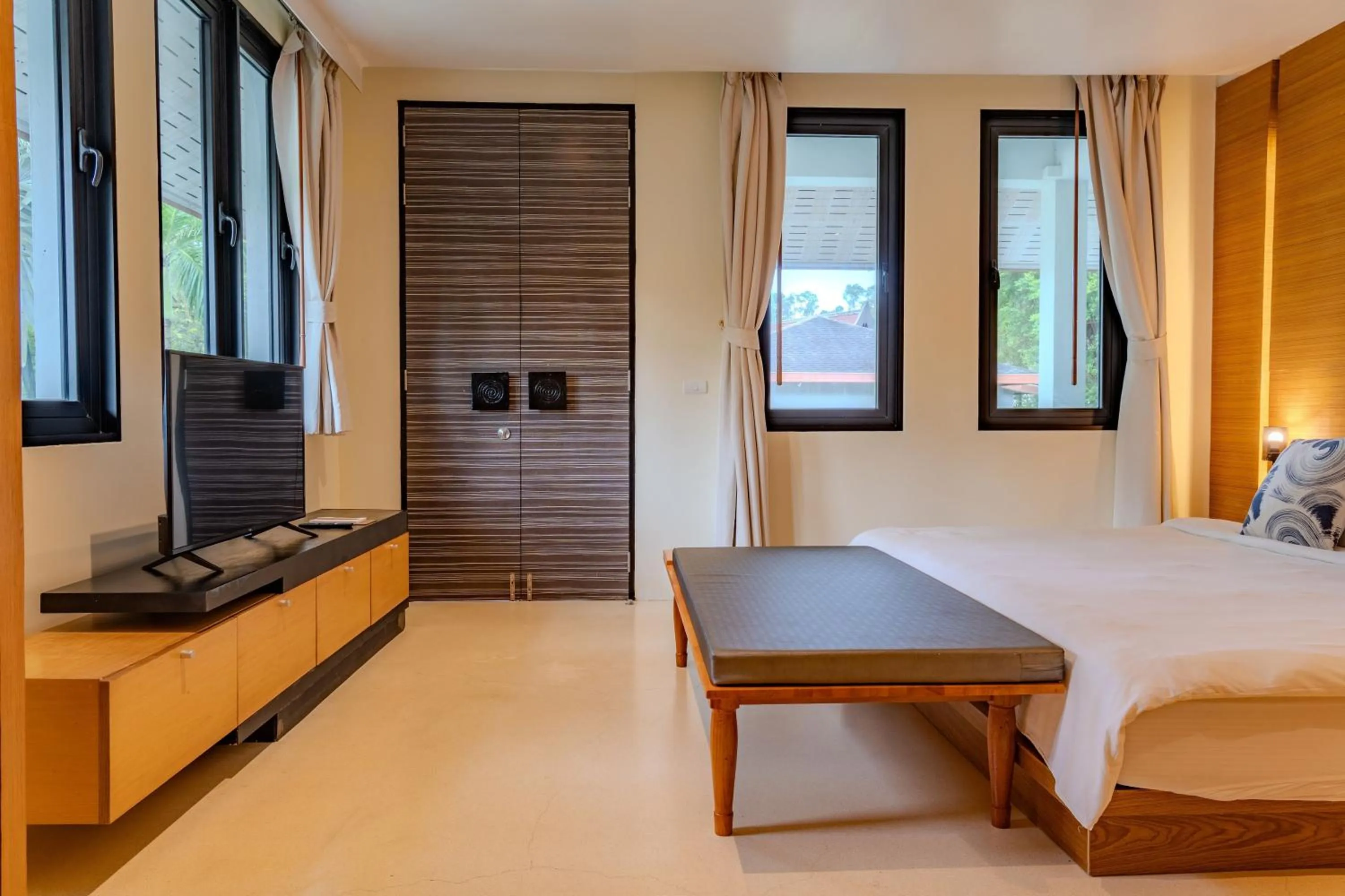 Bed in The Anda Mani Khaolak Beachfront Villas