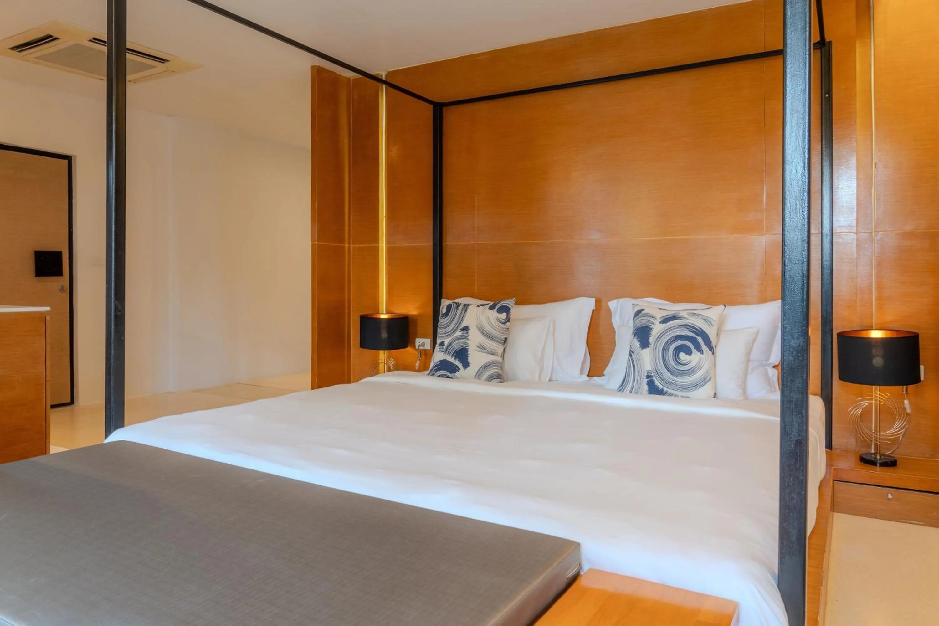 Bed in The Anda Mani Khaolak Beachfront Villas