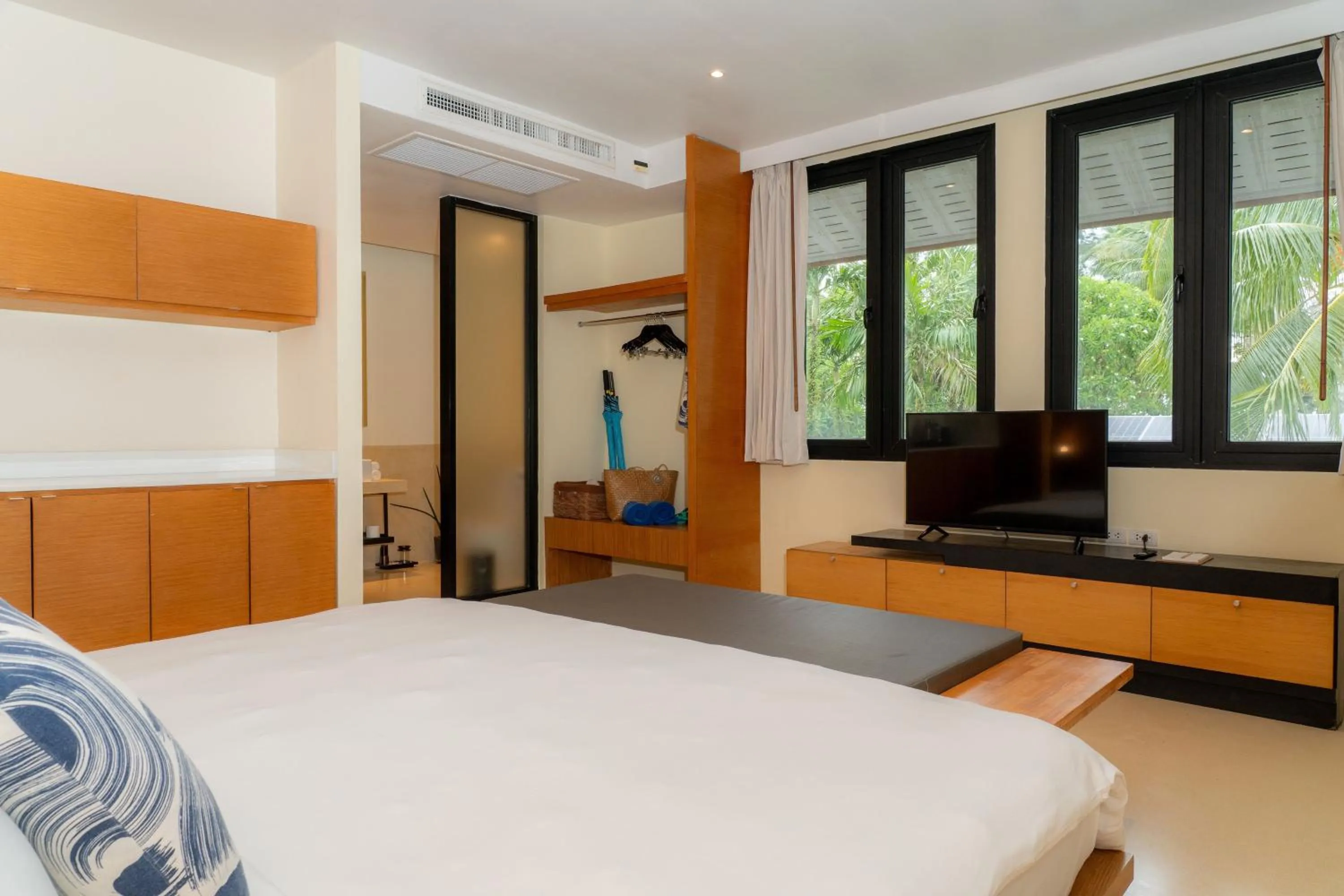 Bed in The Anda Mani Khaolak Beachfront Villas