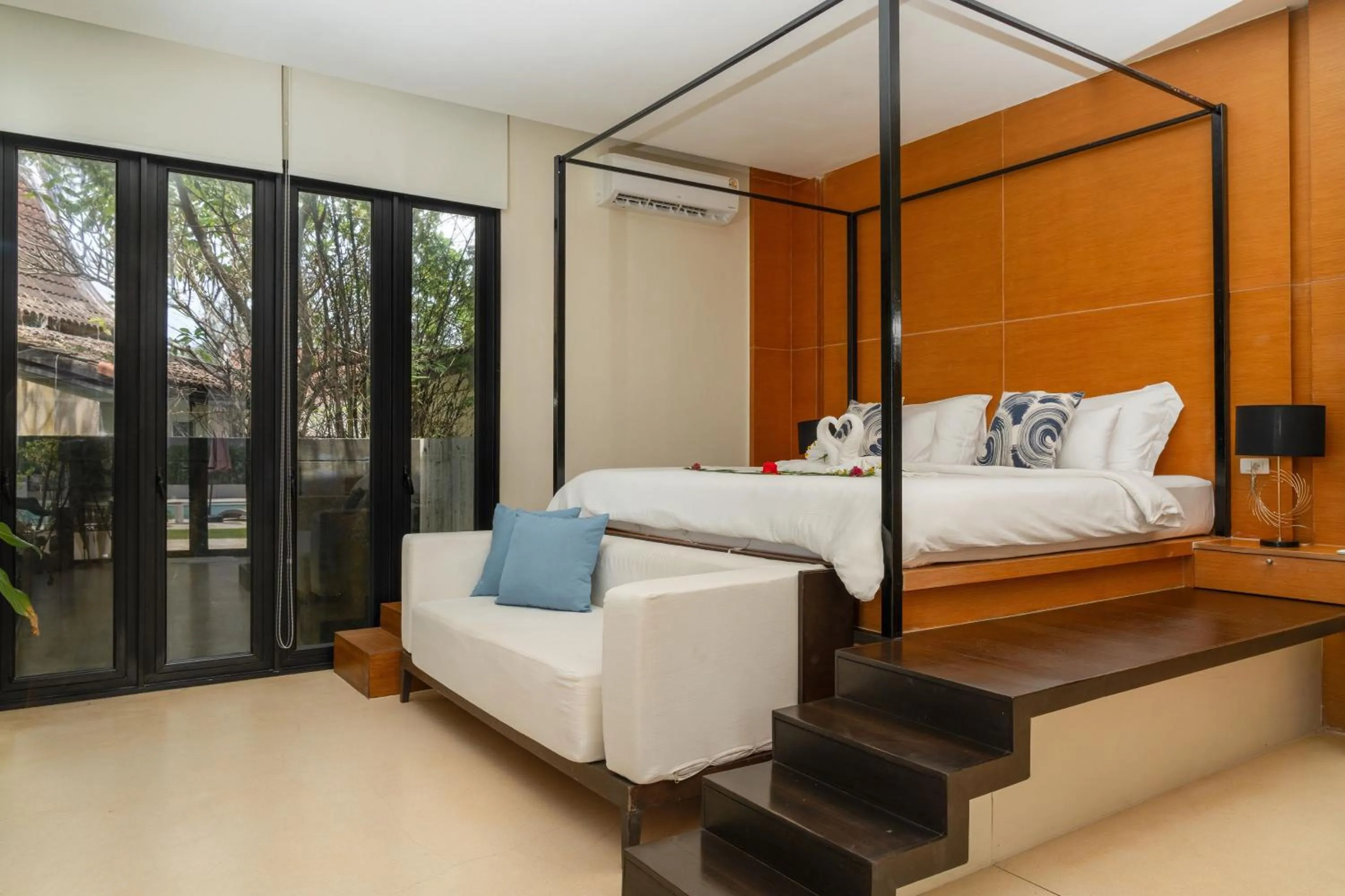 Bed in The Anda Mani Khaolak Beachfront Villas